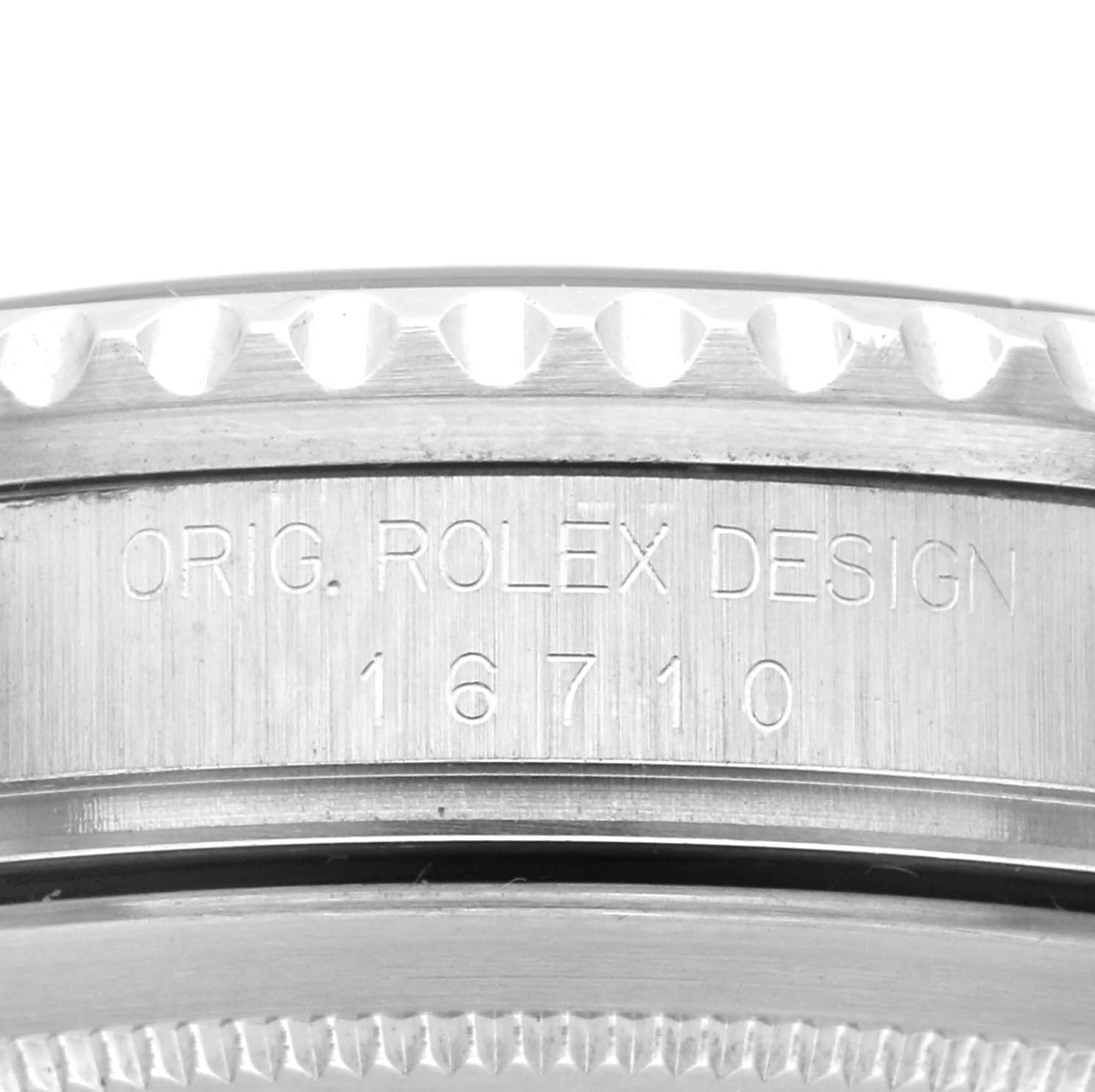 This is a close-up angle of the side of a Rolex GMT-Master 16710 Men's Stainless Steel Black Dial 16710 Men's Stainless Steel Black Dial watch, showing the engraved model number 16710.