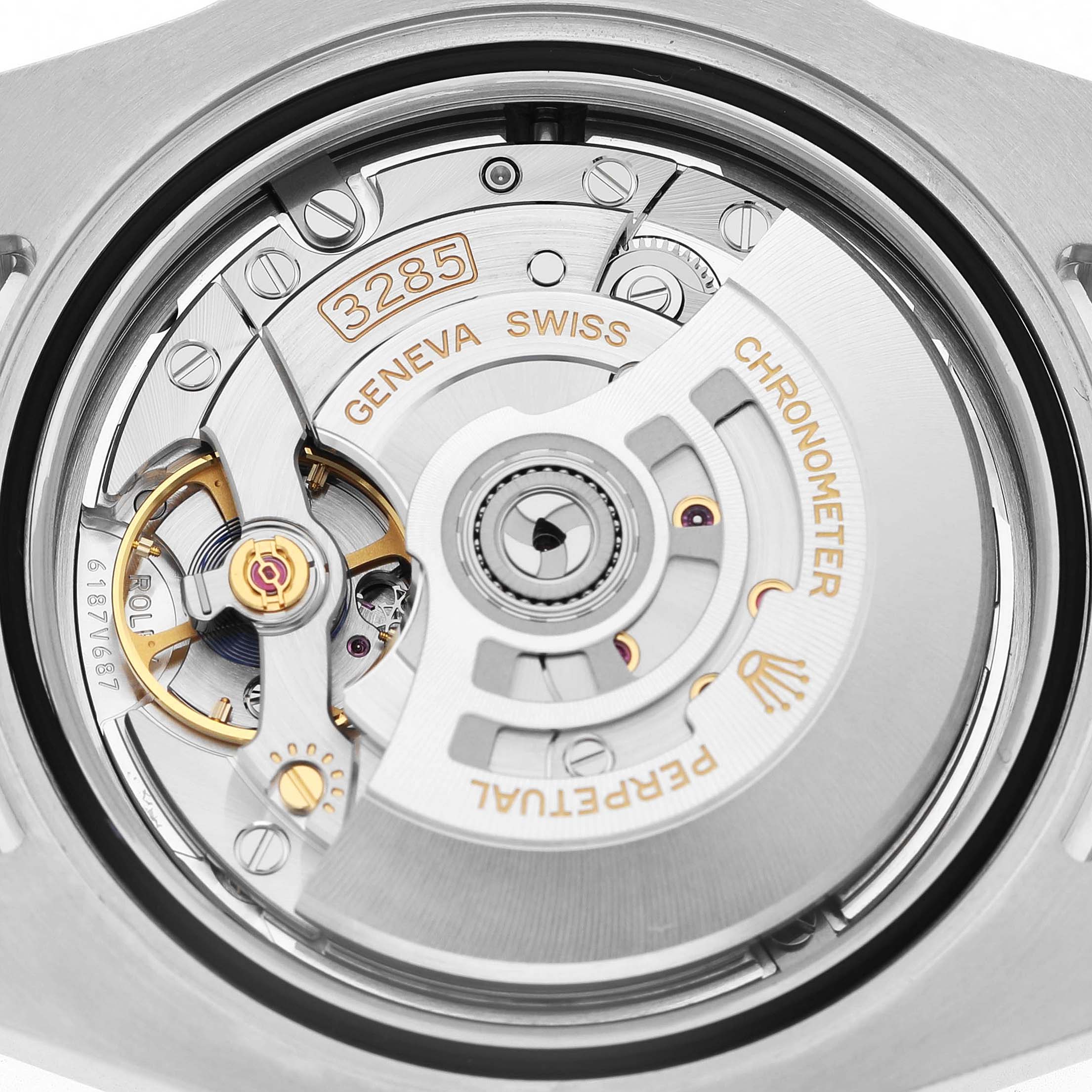 The image shows a close-up of the movement and rotor of a Rolex GMT-Master 126710 Men's Stainless Steel Black Dial watch.