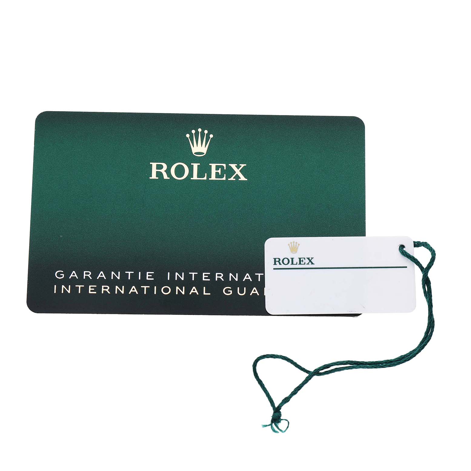The image shows a green international guarantee card and a tag for the Rolex GMT-Master 126710BLRO Men's Stainless Steel Black Dial.