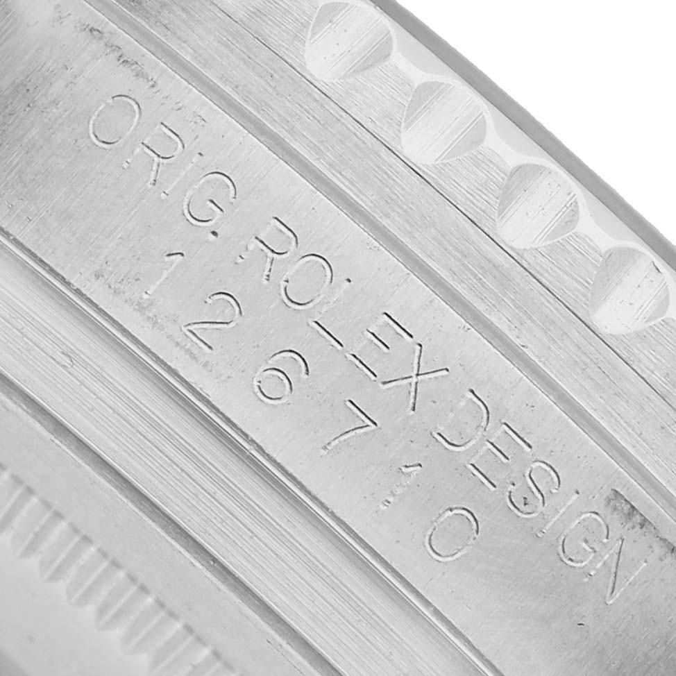 The image shows a close-up of the inside case engraving on a Rolex GMT-Master 126710BLRO Men's Stainless Steel Black Dial, displaying the model and branding details.