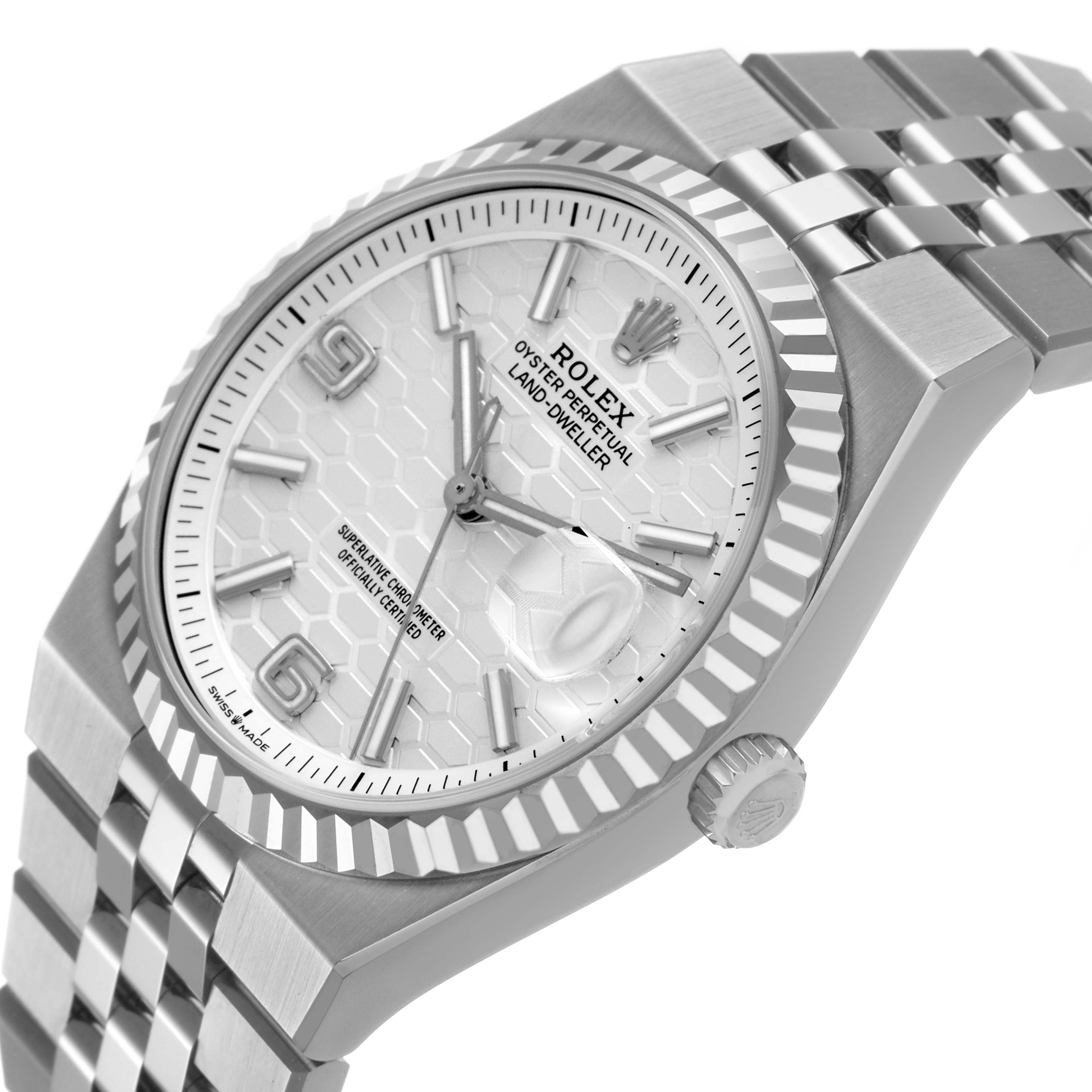 The Rolex Land-Dweller is shown at an angled top-side view, highlighting the bezel, dial, crown, and part of the bracelet.