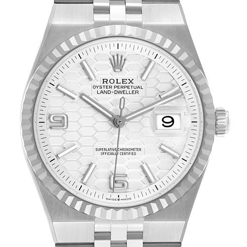 The Rolex Land-Dweller watch is shown from a front view, highlighting the dial, bezel, and part of the bracelet.