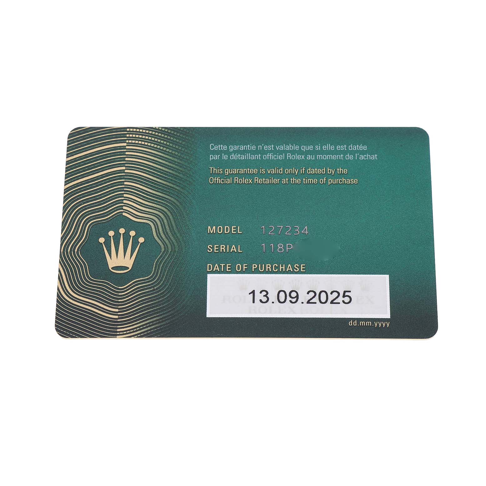 The image shows a warranty card for the Rolex Land‑Dweller 127234 Men's Stainless Steel White Dial model, featuring the model number, serial number, and purchase date.