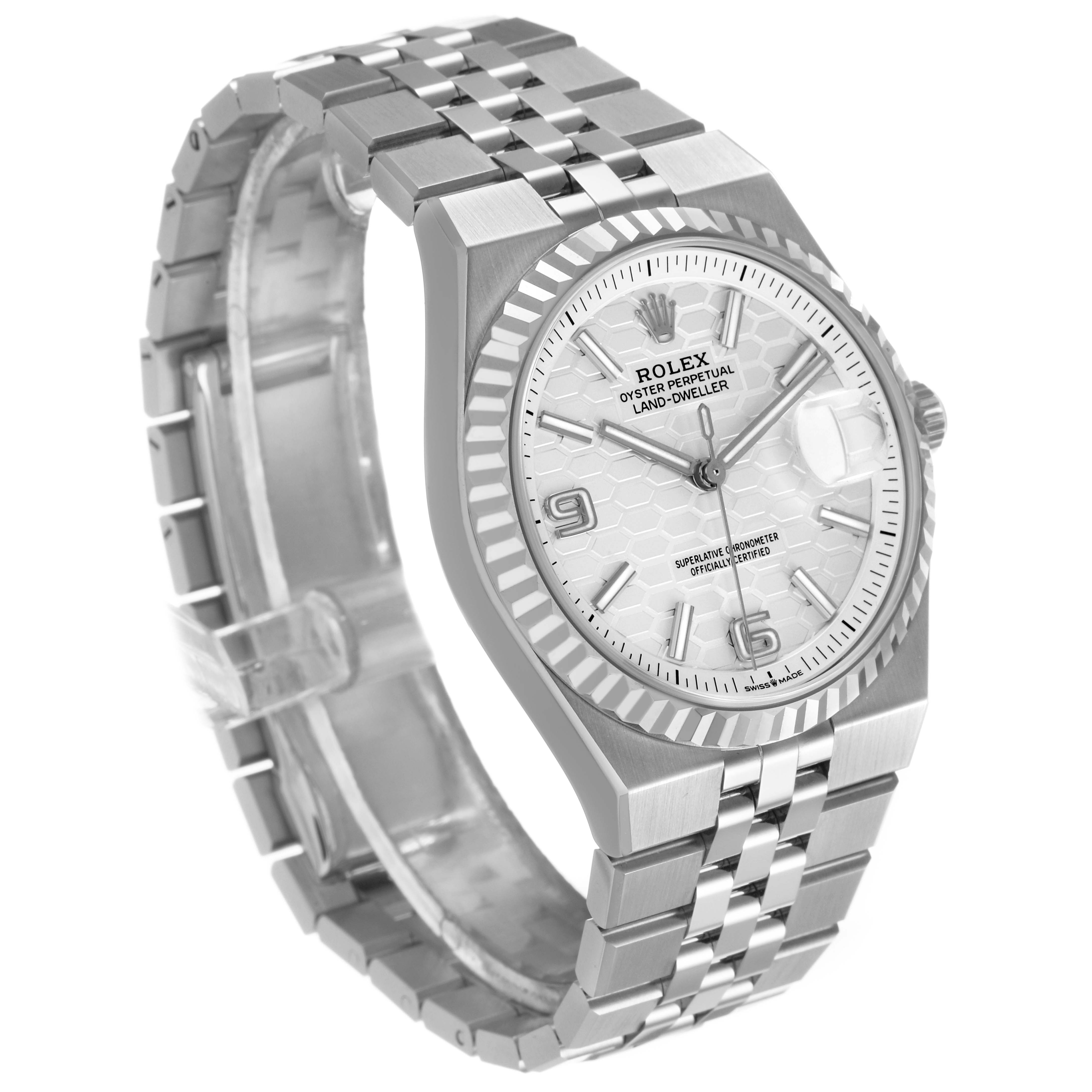 The Rolex Land-Dweller watch is shown at a three-quarter angle, displaying its face, bezel, crown, and Jubilee bracelet.