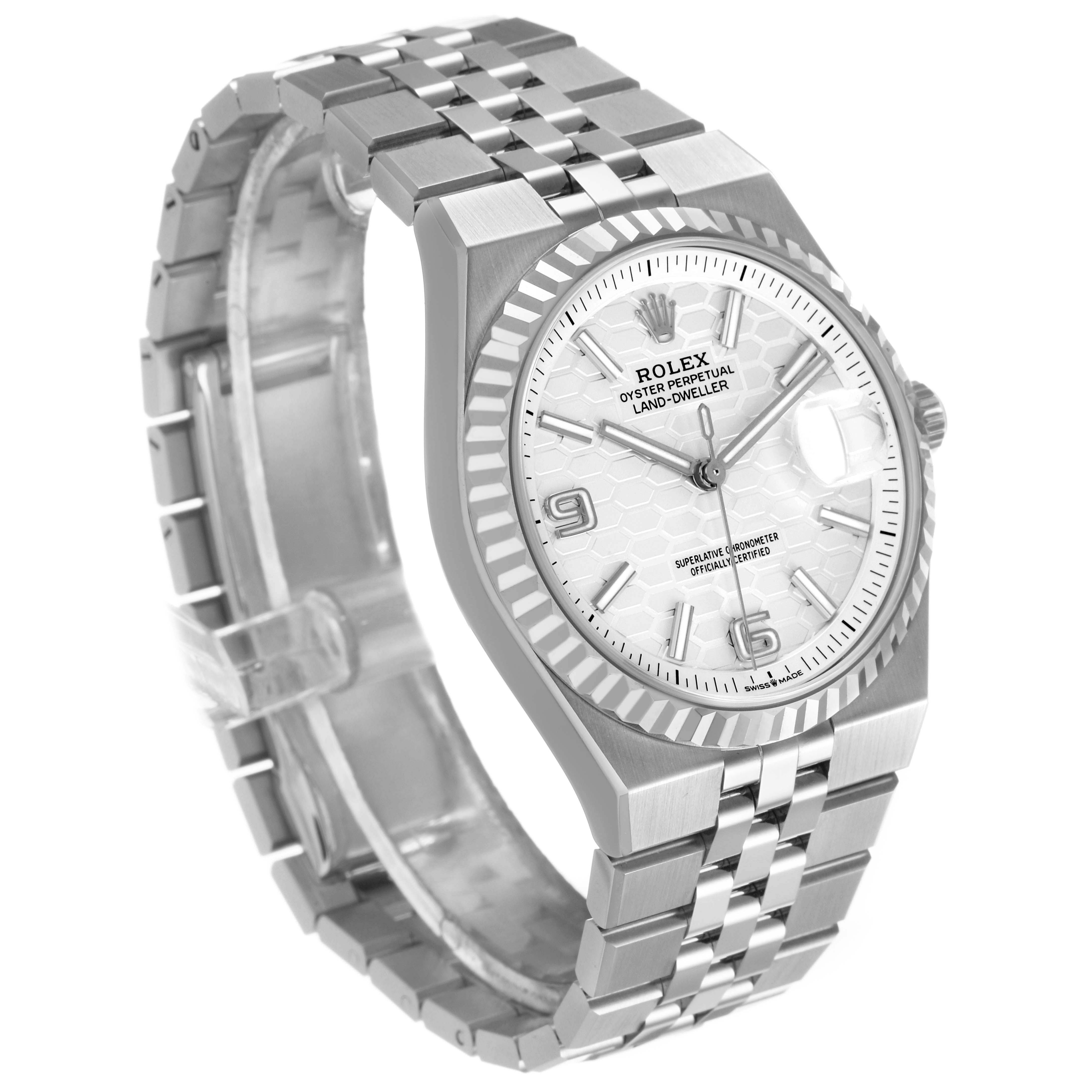 The image shows a Rolex Land‑Dweller 127234 Mens Stainless Steel White Dial watch at a three-quarter angle highlighting the face, bezel, and bracelet.