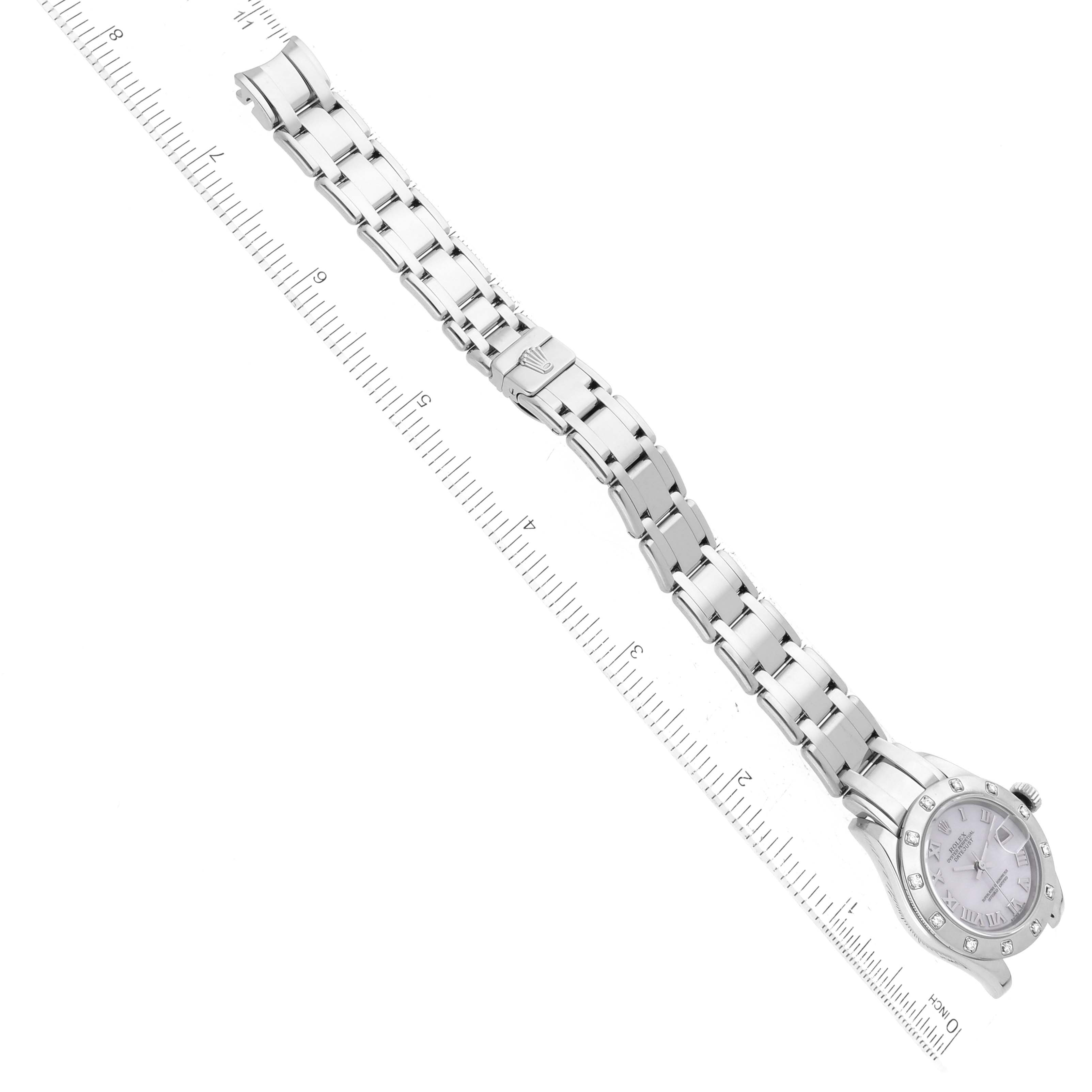 The image shows a top-down view of the Rolex Pearlmaster 80319 Women's White Gold Mother of Pearl Dial 80319 Women's White Gold Mother of Pearl Dial watch, displaying the face, bracelet, and clasp next to a ruler for scale.