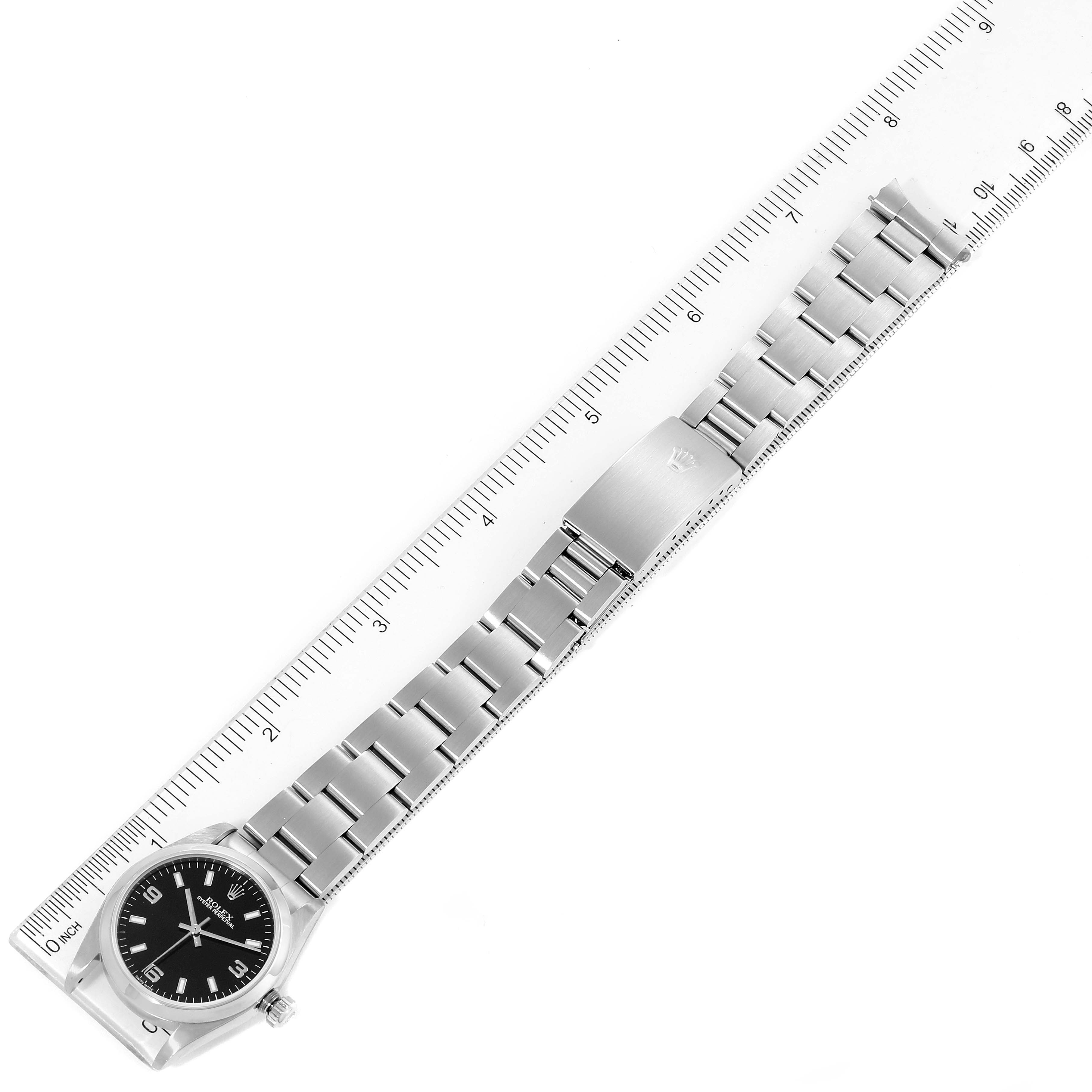 The image shows a Rolex Mid-Size 77080 Women's Stainless Steel Black Dial 77080 Women's Stainless Steel Black Dial model watch with its dial, bracelet, and clasp, positioned alongside a ruler.