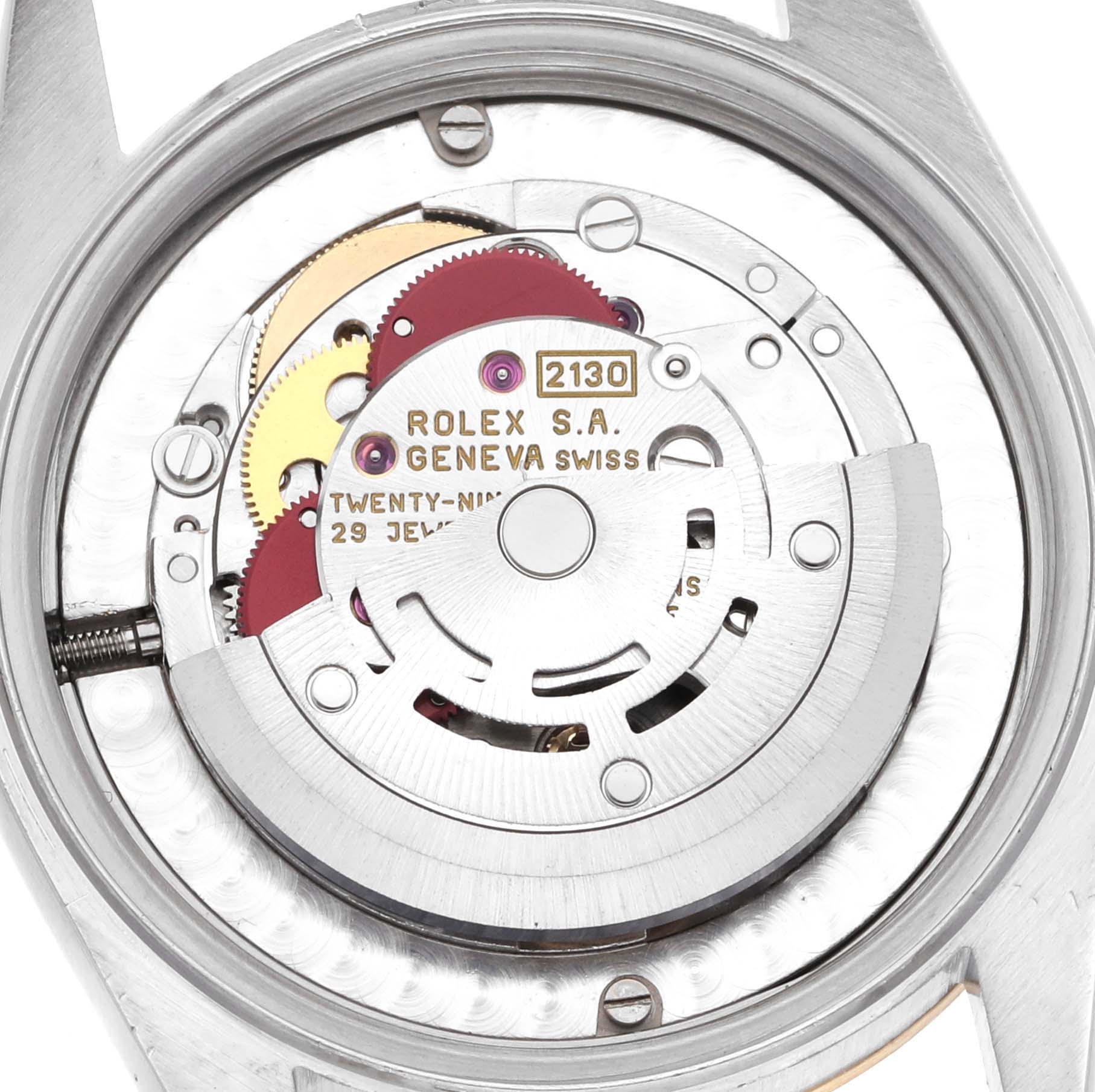 This image shows the inner mechanism of a Mid-Size Rolex watch model viewed from the back, highlighting the movement components.