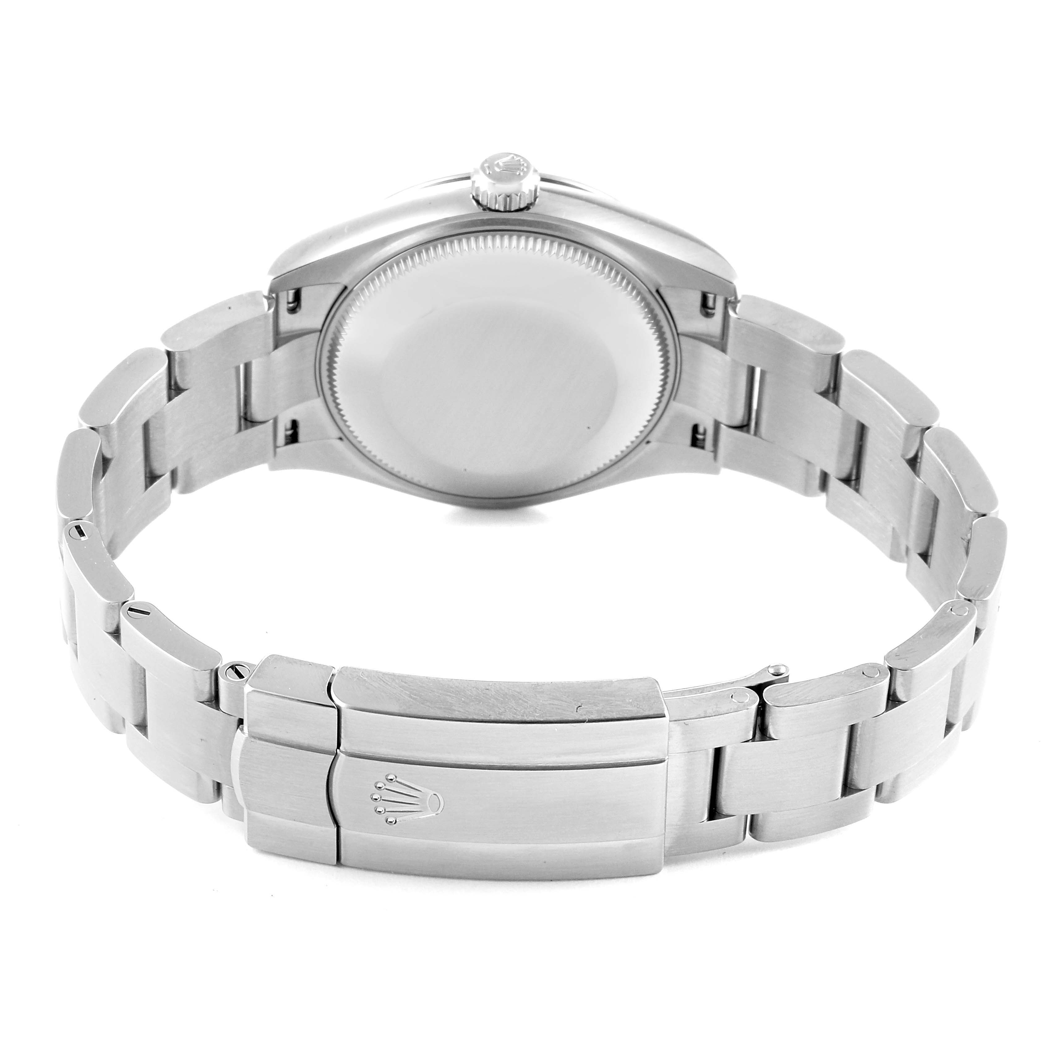 The image shows the back view of a Mid-Size Rolex watch focusing on the clasp and bracelet.