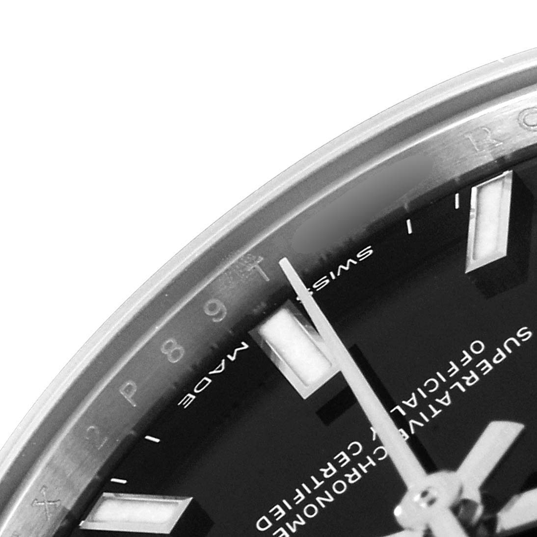 This image shows a close-up of the dial and hands of a Mid-Size model Rolex watch, viewed from an angled top perspective.