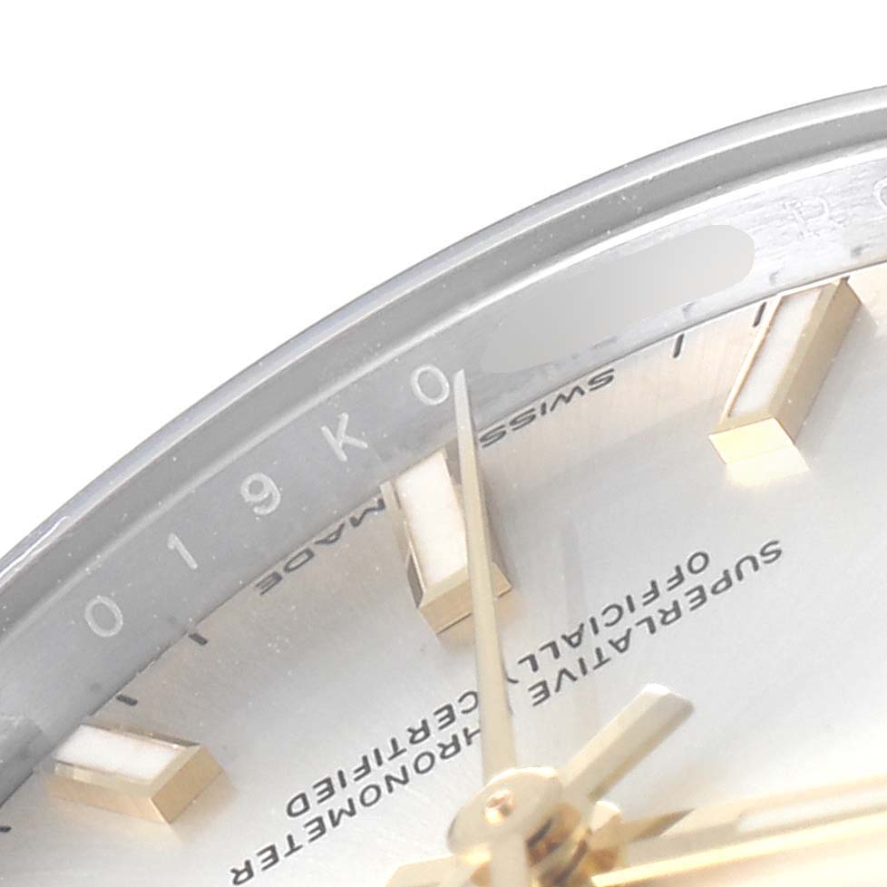 The image shows a close-up of a Rolex Mid-Size 277200 Women's Stainless Steel Silver Dial 277200 Women's Stainless Steel Silver Dial watch, focusing on part of the dial, hour markers, and second hand.