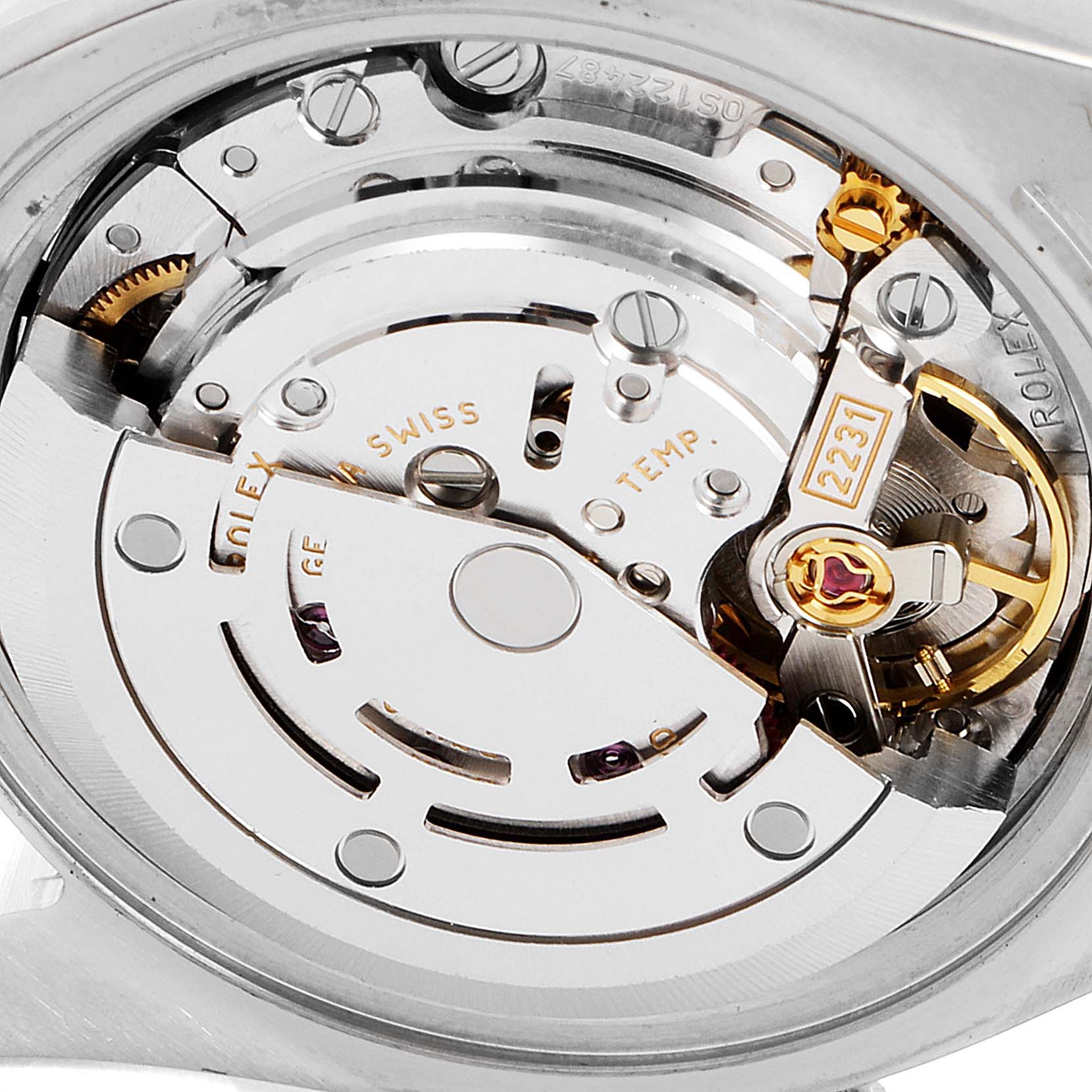 The image shows the intricate internal mechanism and movement of a Rolex Oyster Perpetual 176200 Women
s Stainless Steel Pink Dial 176200 Women
s Stainless Steel Pink Dial watch from a close-up angle.