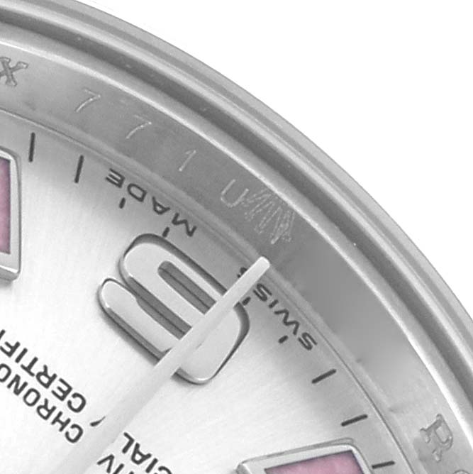 The image shows a close-up of the dial and bezel edge of a Rolex Oyster Perpetual 176200 Women
s Stainless Steel Silver Dial watch, focusing on the hour markers and part of the hands.