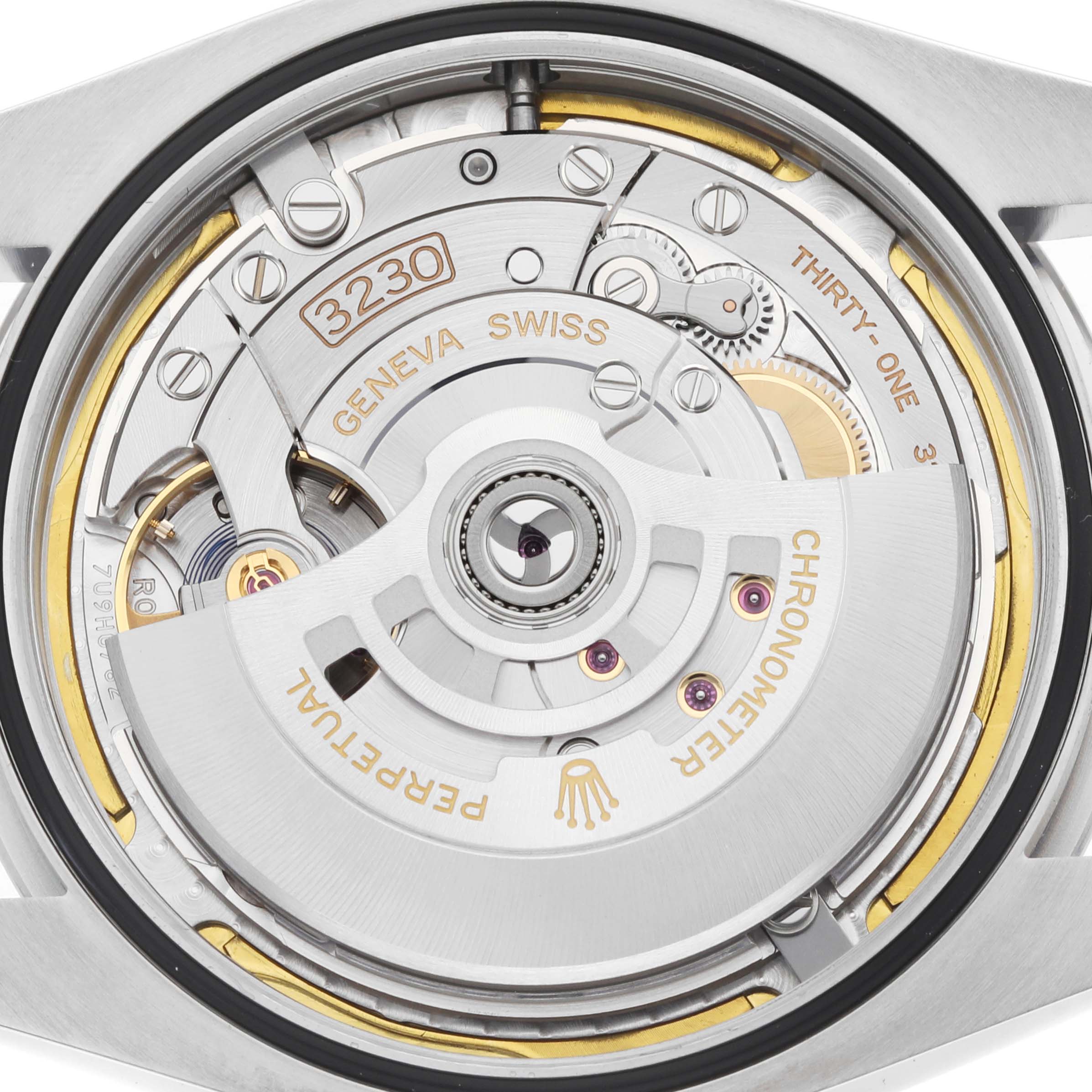 The image shows the movement and rotor of a Rolex Oyster Perpetual 124300 Men
s Stainless Steel Blue Dial watch from a rear angle.