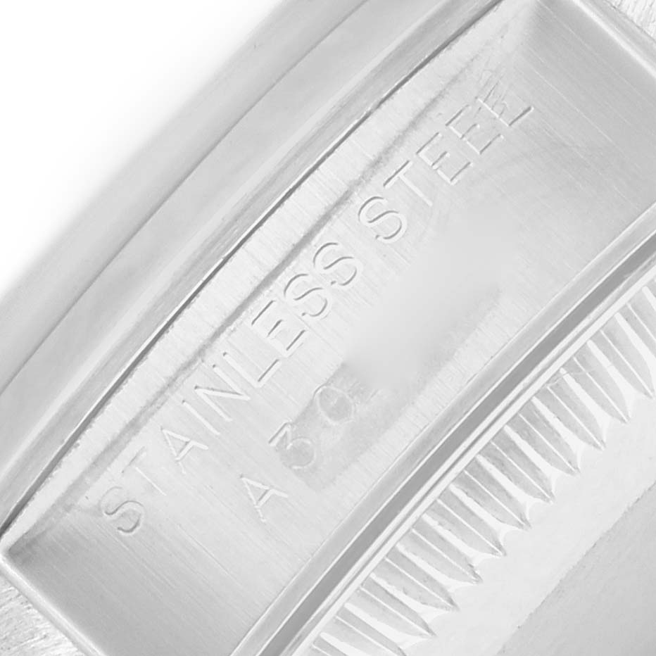 The image shows a close-up of the case back of the Rolex Oyster Perpetual 76080 Women
s Stainless Steel Black Dial, highlighting the "Stainless Steel" engraving.
