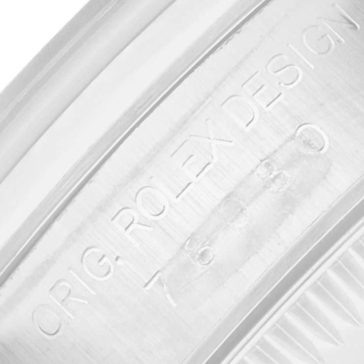 The close-up image shows the engraved side of the Rolex Oyster Perpetual 76080 Women
s Stainless Steel Black Dial watch, highlighting the "ORIG ROLEX DESIGN" text.