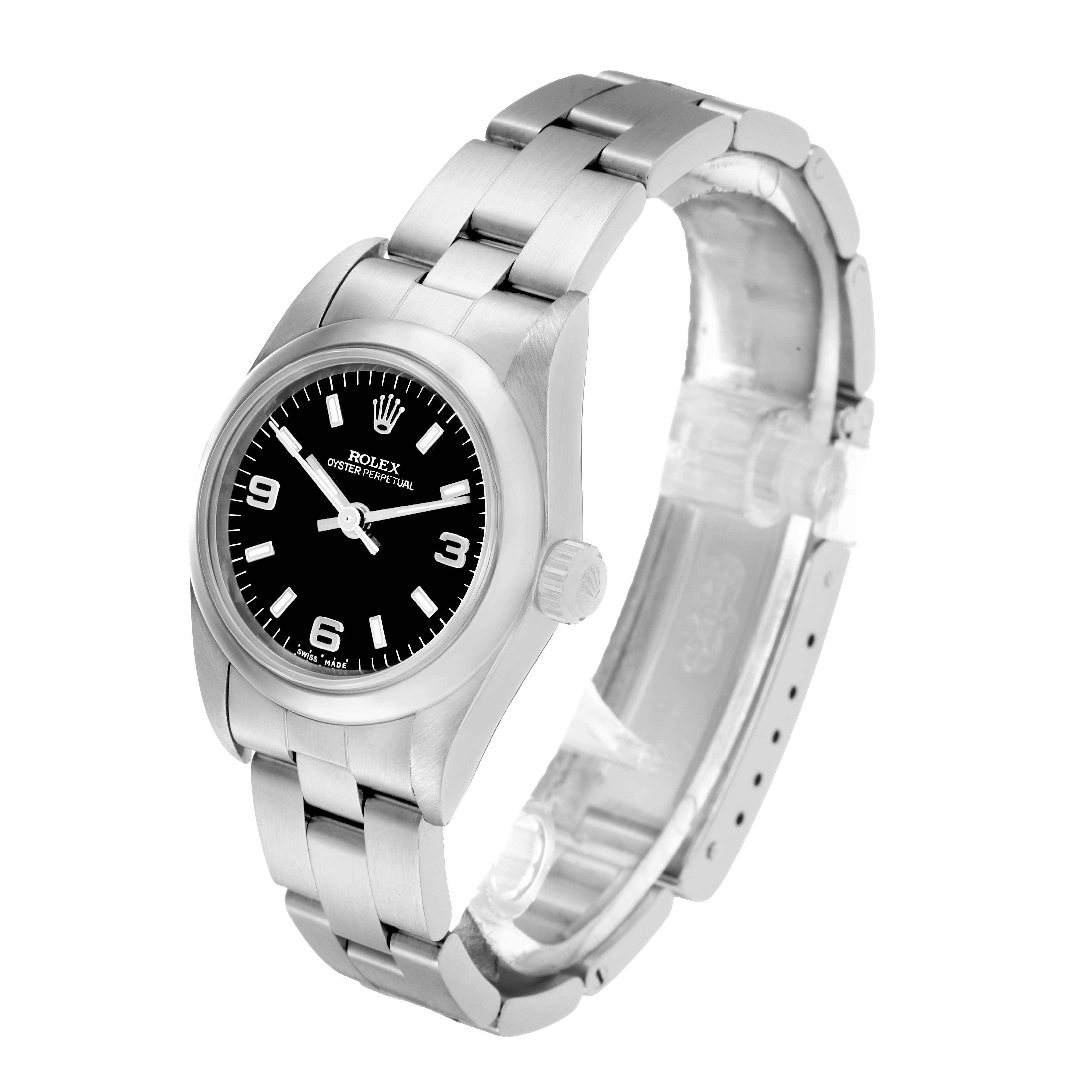 The Rolex Oyster Perpetual 76080 Women
s Stainless Steel Black Dial watch is shown at a three-quarter angle, displaying its dial, crown, and part of the bracelet.