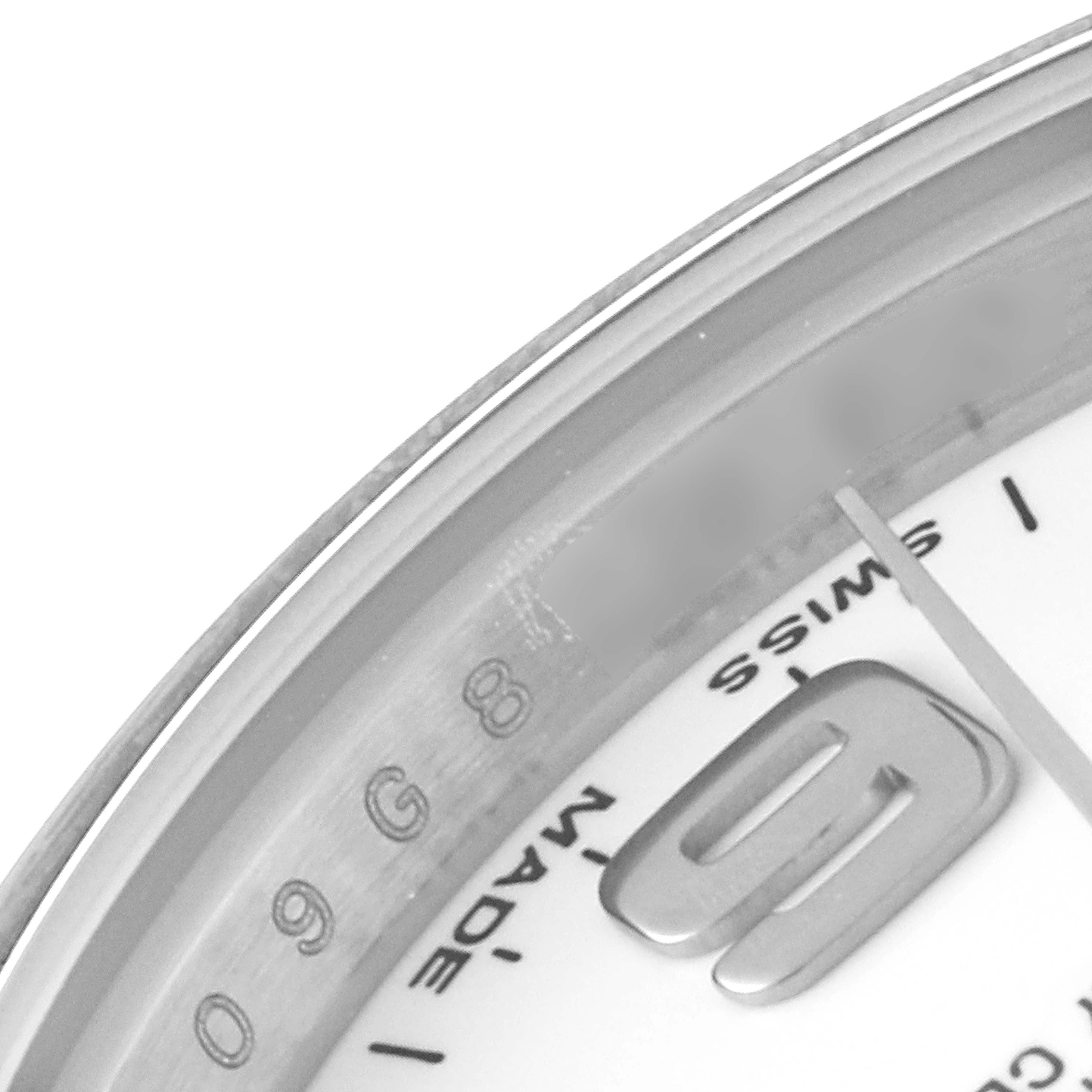 This close-up angle of the Rolex Oyster Perpetual 176200 Women's Stainless Steel White Dial 176200 Women's Stainless Steel White Dial watch shows part of the dial, including the numbers, markers, and "Swiss Made" text.