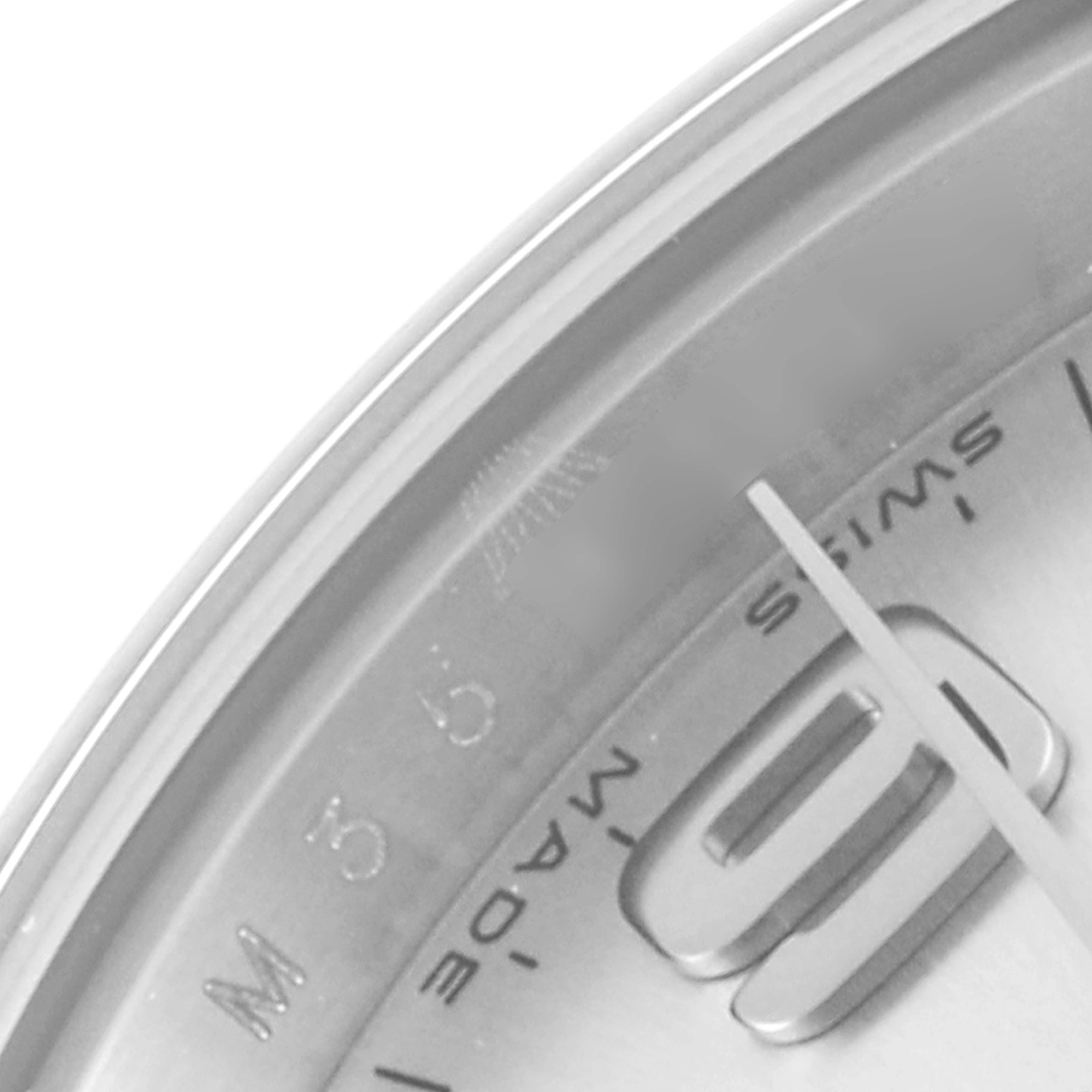 This image shows a close-up of the dial and part of the case of a Rolex Oyster Perpetual 176200 Women's Stainless Steel Silver Dial 176200 Women's Stainless Steel Silver Dial watch, highlighting the number '9' and 'Swiss Made' text.