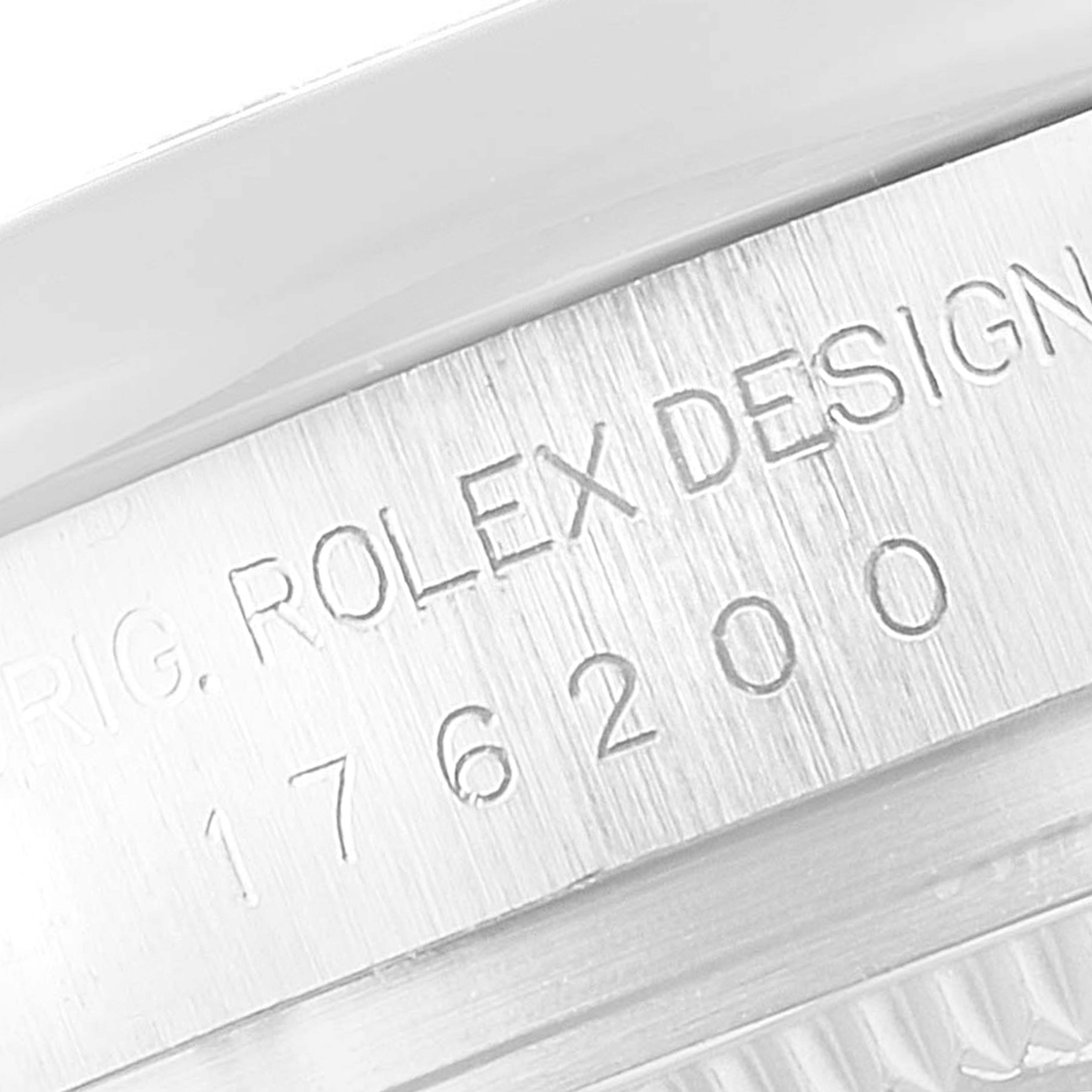 The image shows an angled close-up of the engraving on the underside of a Rolex Oyster Perpetual 176200 Women's Stainless Steel Silver Dial 176200 Women's Stainless Steel Silver Dial watch casing.