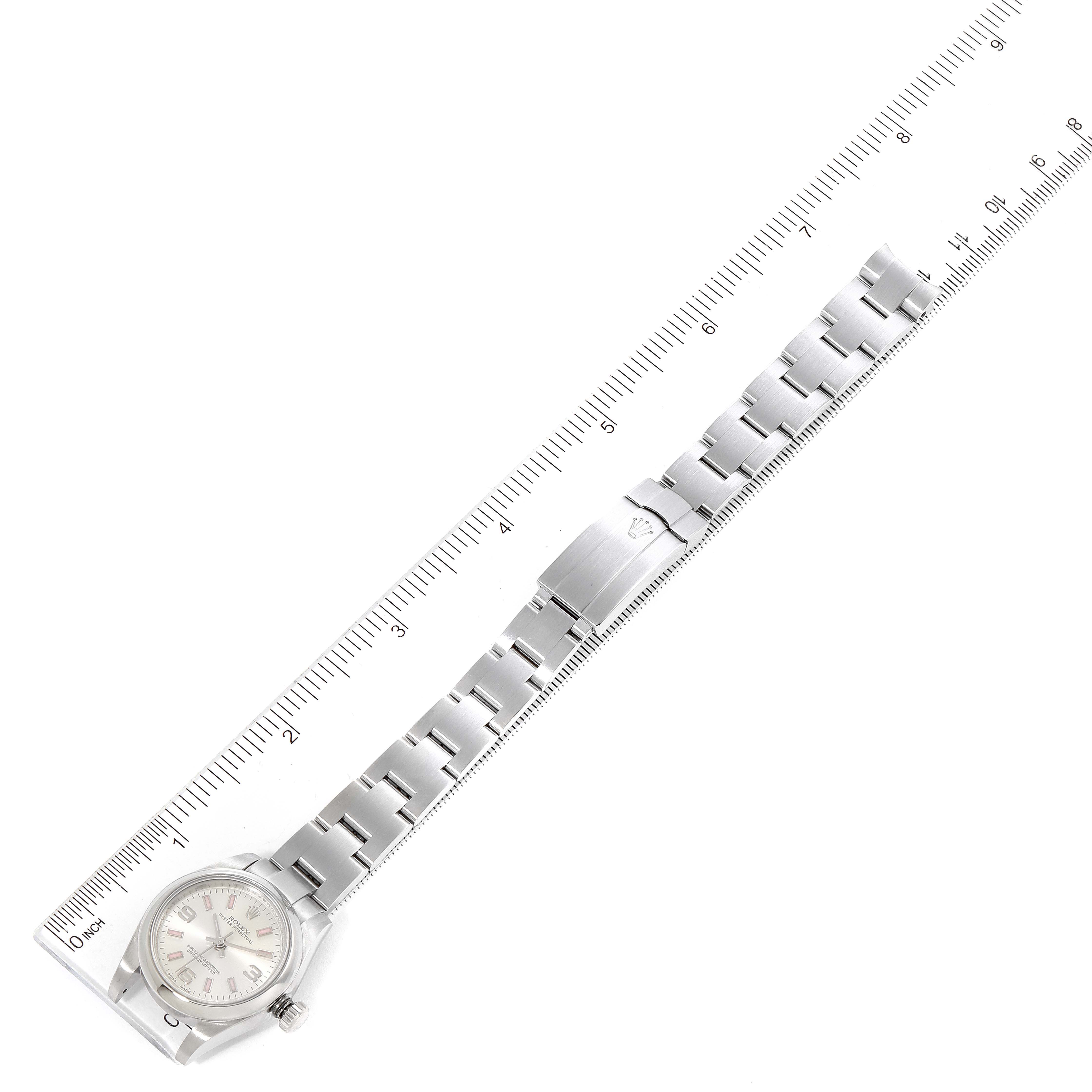 The image shows a Rolex Oyster Perpetual 176200 Women's Stainless Steel Silver Dial 176200 Women's Stainless Steel Silver Dial watch laid out flat next to a ruler, displaying the full watch band and face.