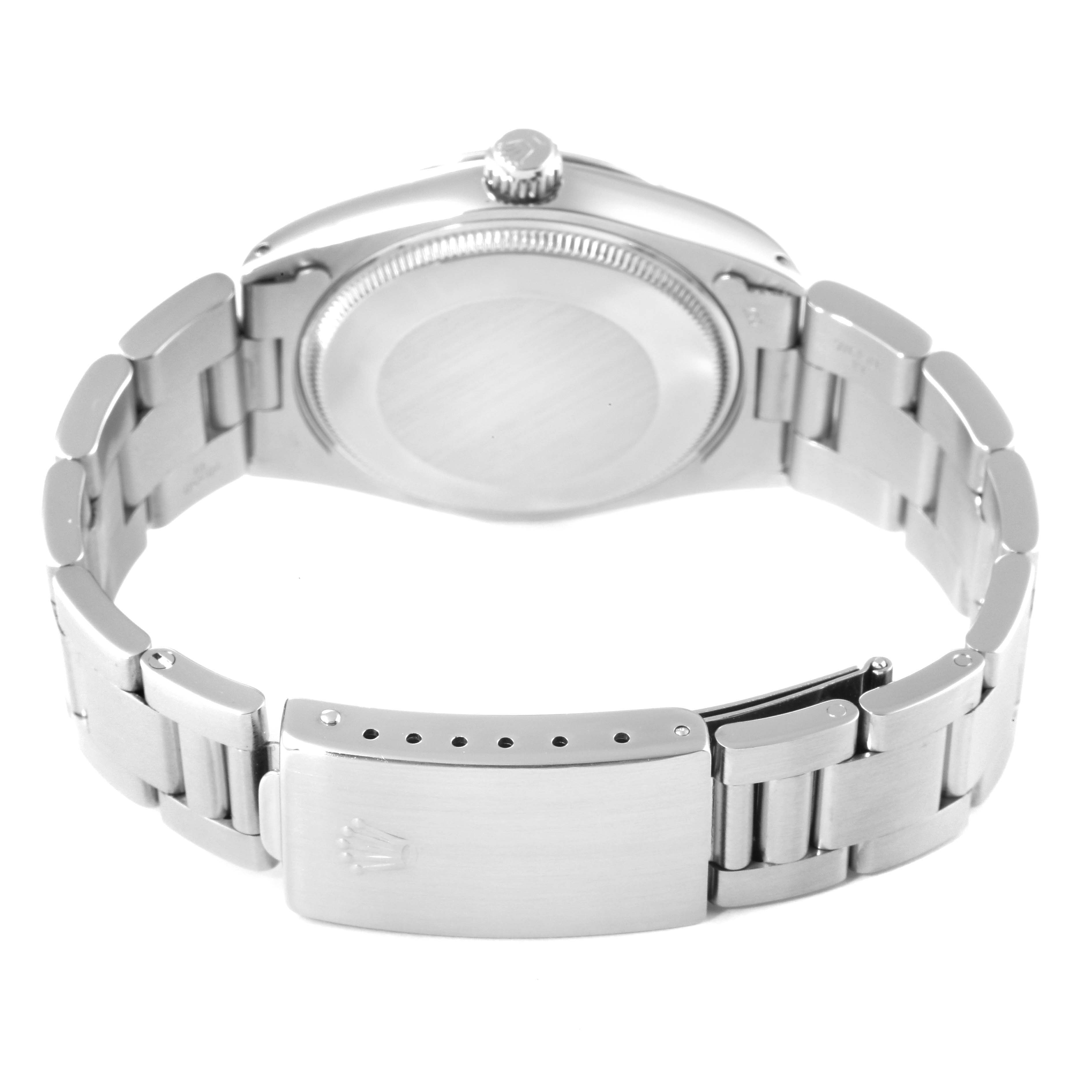 This image shows the back casing and bracelet clasp of a Vintage Collection model Rolex watch from a rear angle.