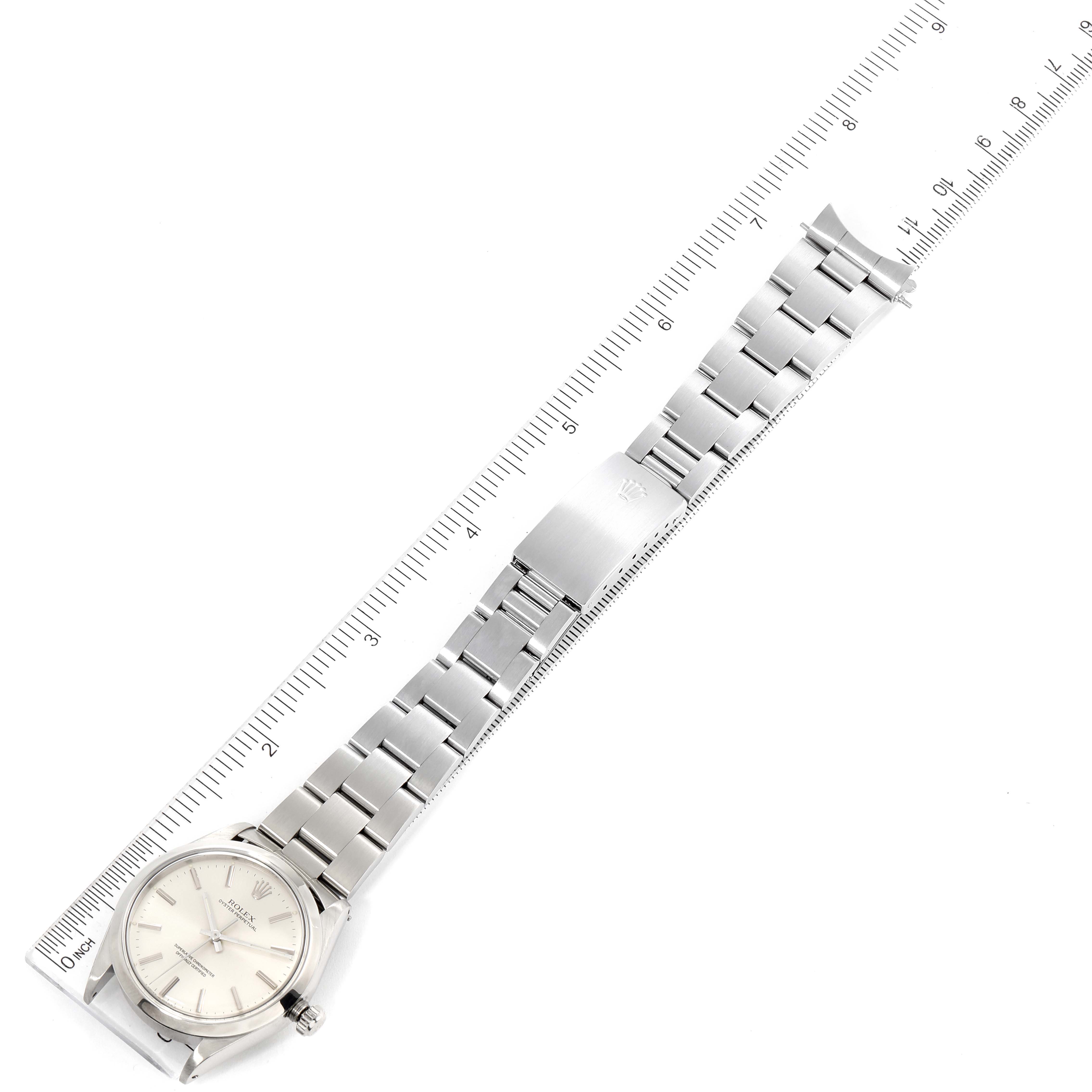 The image shows a top-down view of the Rolex Vintage Collection 1002 Men
s Stainless Steel Silver Dial 1002 Men
s Stainless Steel Silver Dial watch, displaying the face, bracelet, and clasp.