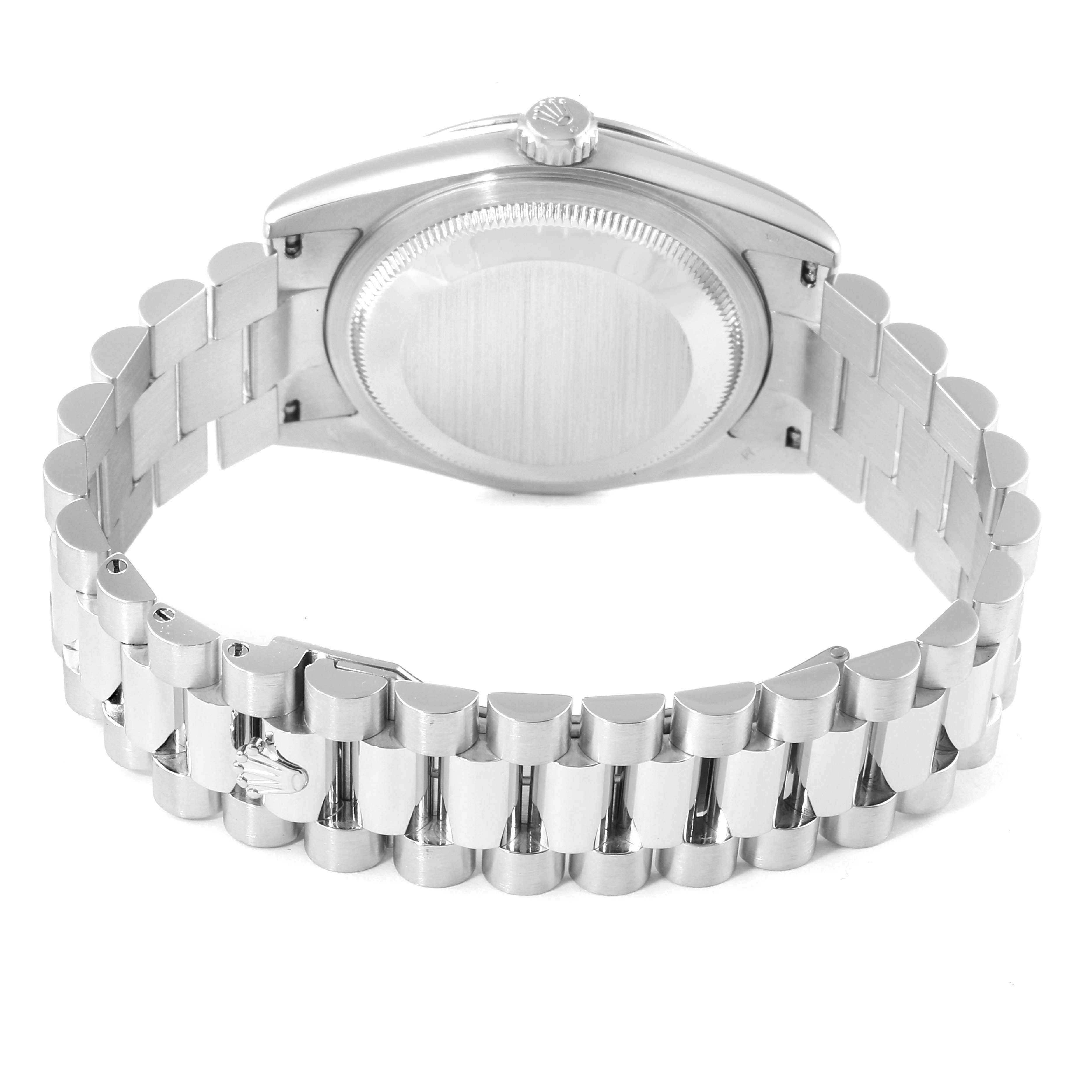 The image shows the backside of a Rolex President 118206 Men's Platinum Blue Dial 118206 Men's Platinum Blue Dial model watch including the case, crown, and bracelet.