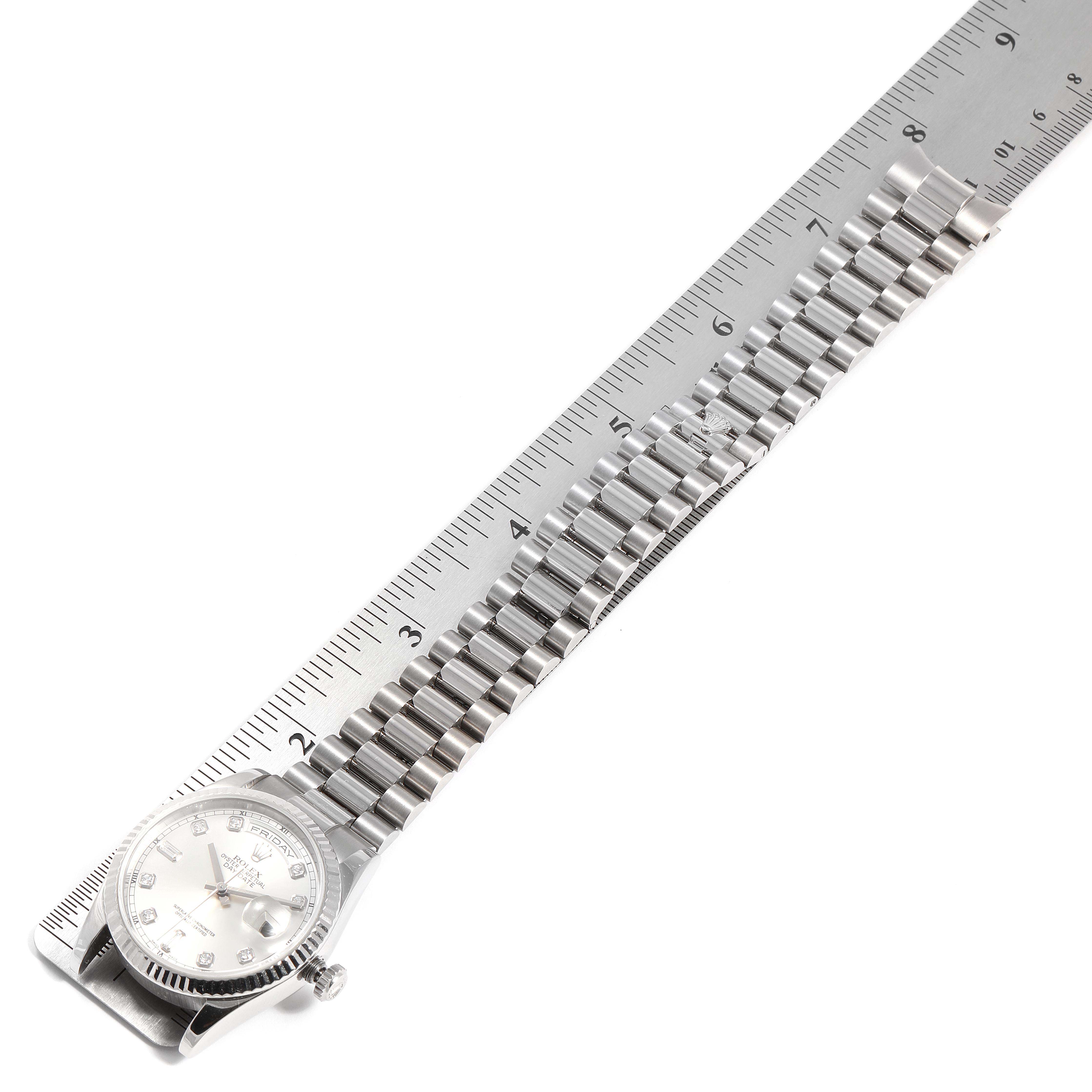 The image shows a Rolex President 118239 Men's White Gold Silver Dial 118239 Men's White Gold Silver Dial model watch laid flat with its bracelet extended alongside a ruler for measurement.
