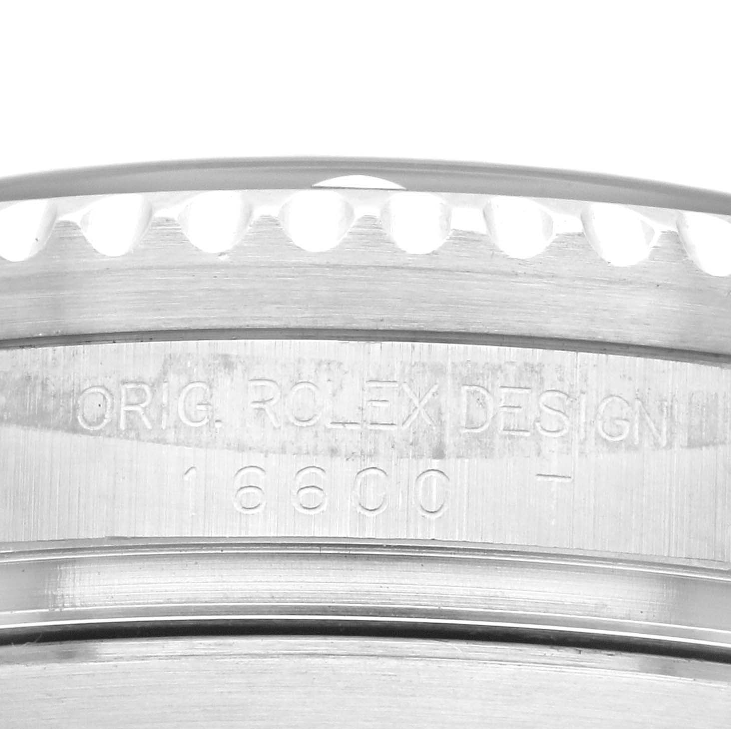 The image shows the engraved side of the bezel and case of a Rolex Sea-Dweller 16600 Men's Stainless Steel Black Dial 16600 Men's Stainless Steel Black Dial model.