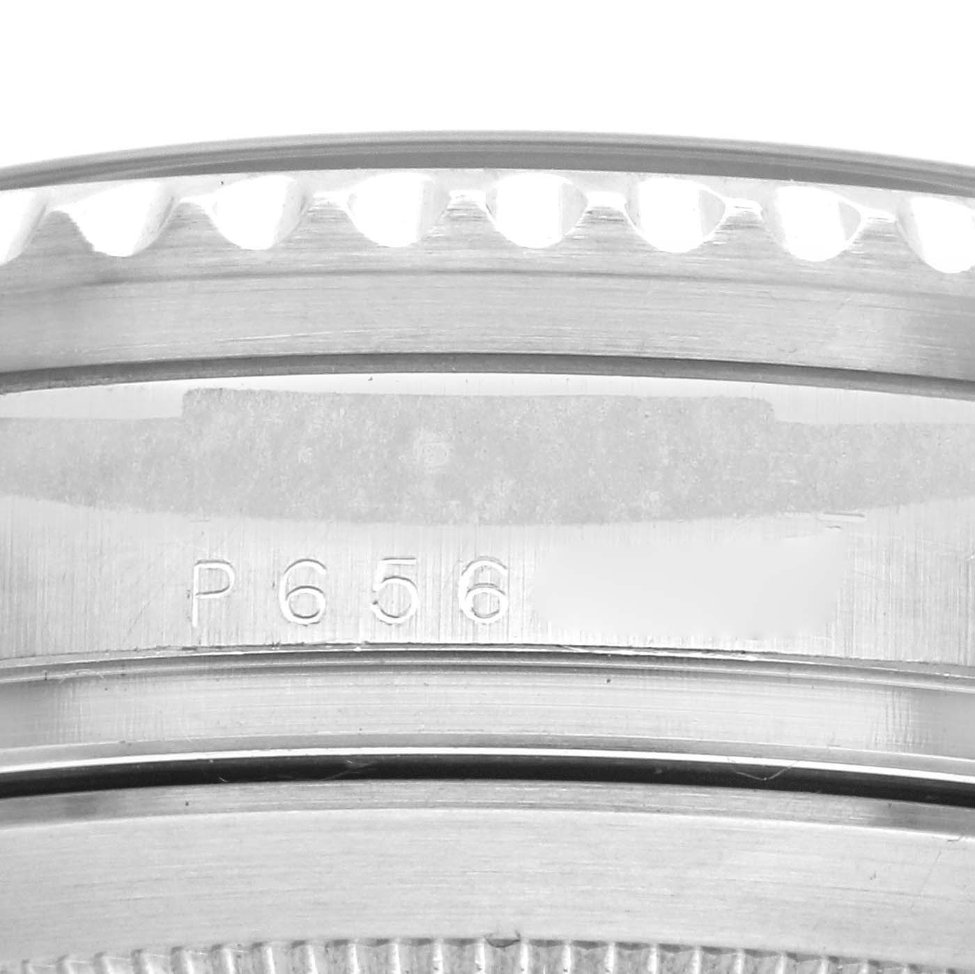 This close-up image shows the engraved serial number on the side of the bezel of a Rolex Sea-Dweller 16600 Men
s Stainless Steel Black Dial 16600 Men
s Stainless Steel Black Dial watch.