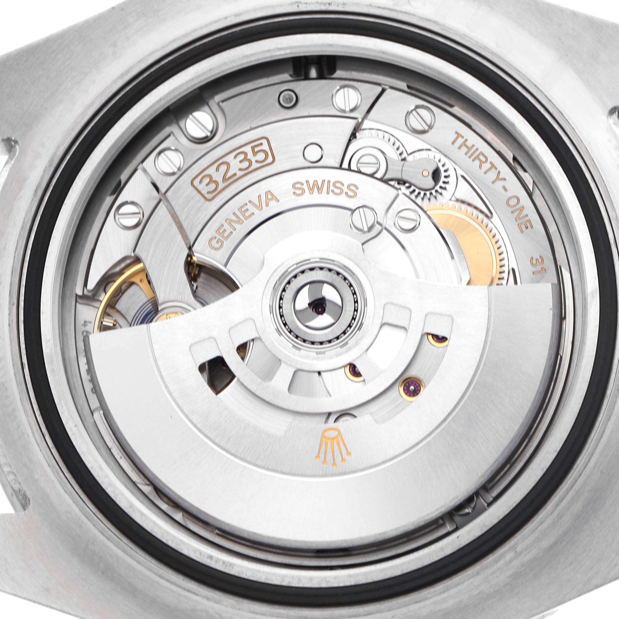 The image shows the movement and intricate internal parts of the Rolex Sea-Dweller 126600 Men's Stainless Steel Black Dial watch from a back view.