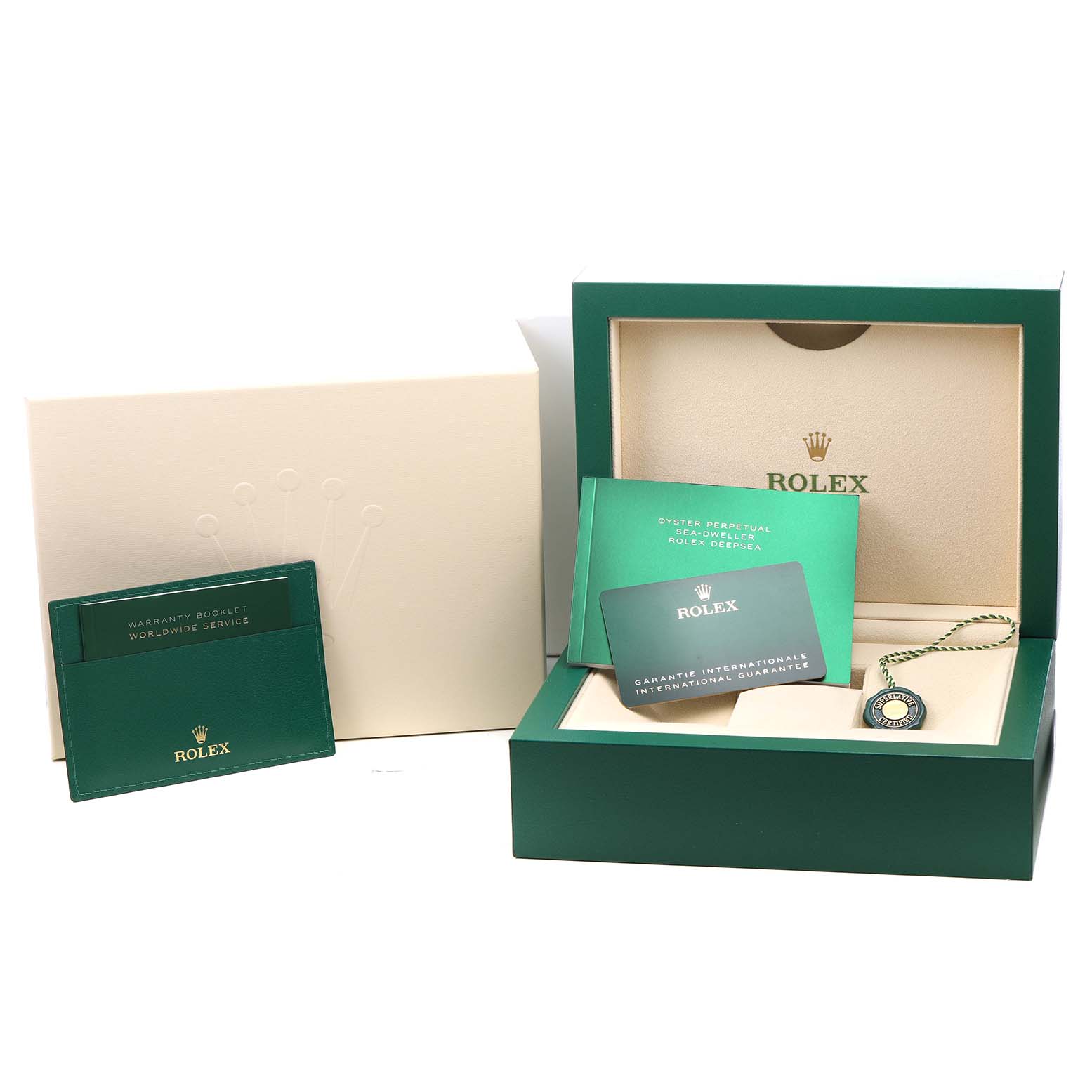 The image shows the packaging, warranty booklet, and service manual of a Rolex Sea-Dweller 126600 Men's Stainless Steel Black Dial watch.
