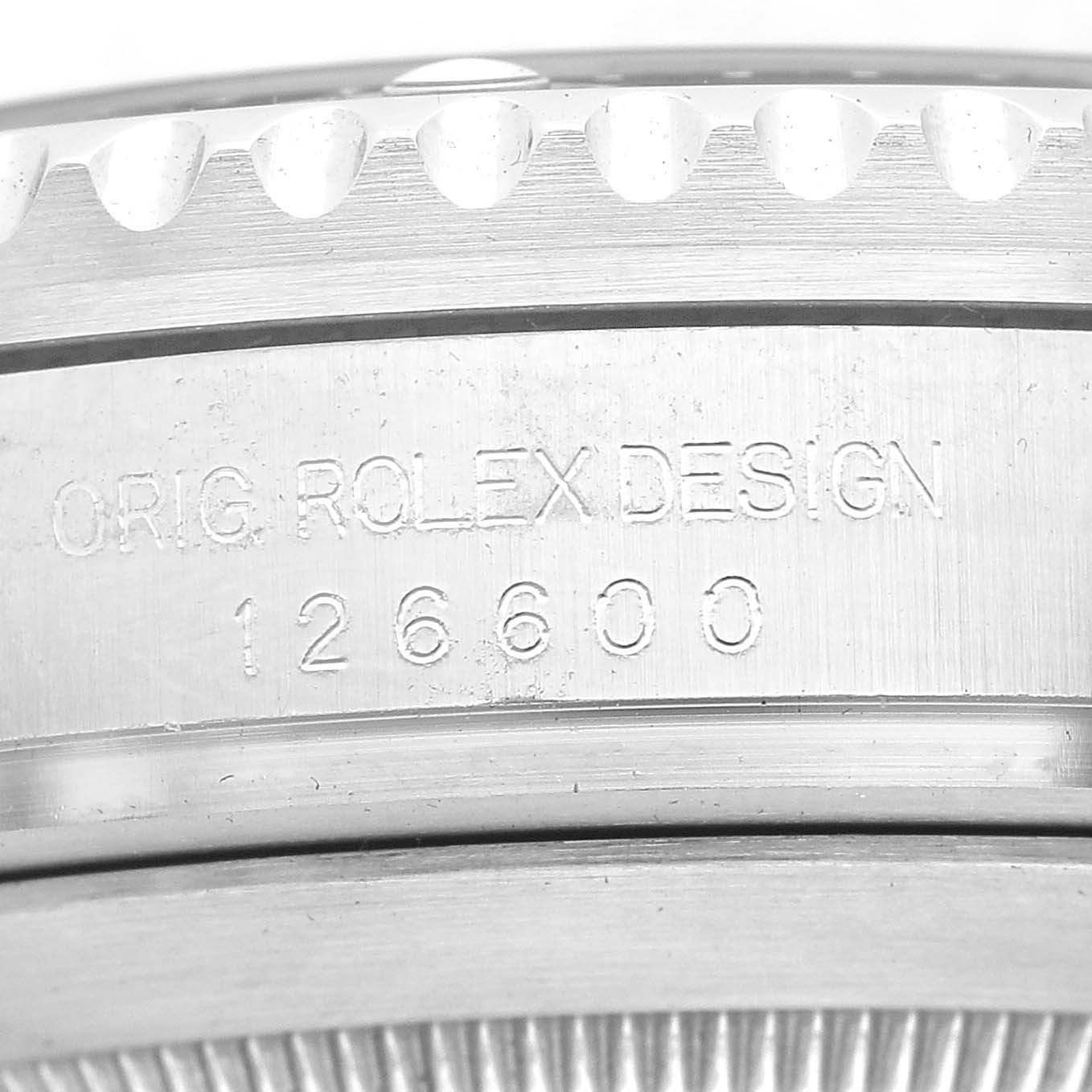 The image shows a close-up of the engraved side casing of a Rolex Sea-Dweller 126600 Men's Stainless Steel Black Dial, displaying its model number "126600."