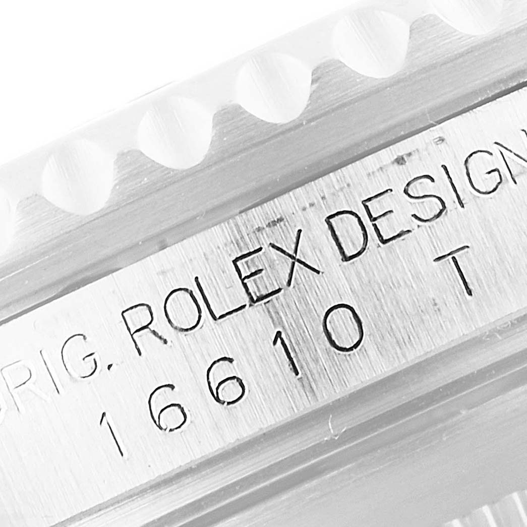This close-up image shows the engraved model number "16610" on the side of a Rolex Submariner 16610 Men
s Stainless Steel Black Dial 16610 Men
s Stainless Steel Black Dial watch.