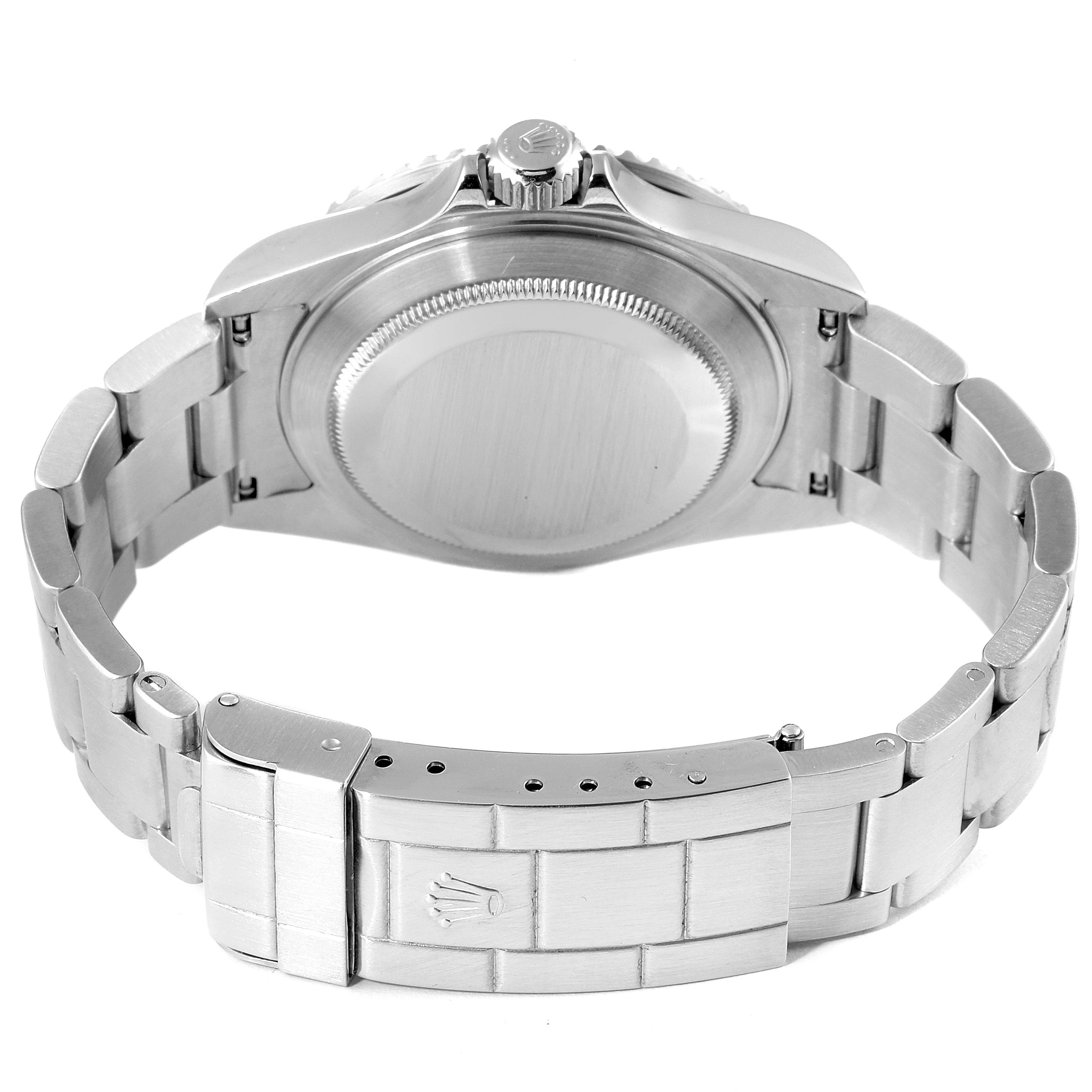 The image shows the back view of a Rolex Submariner 16610 Men
s Stainless Steel Black Dial 16610 Men
s Stainless Steel Black Dial watch, highlighting the case back, crown, and bracelet clasp.