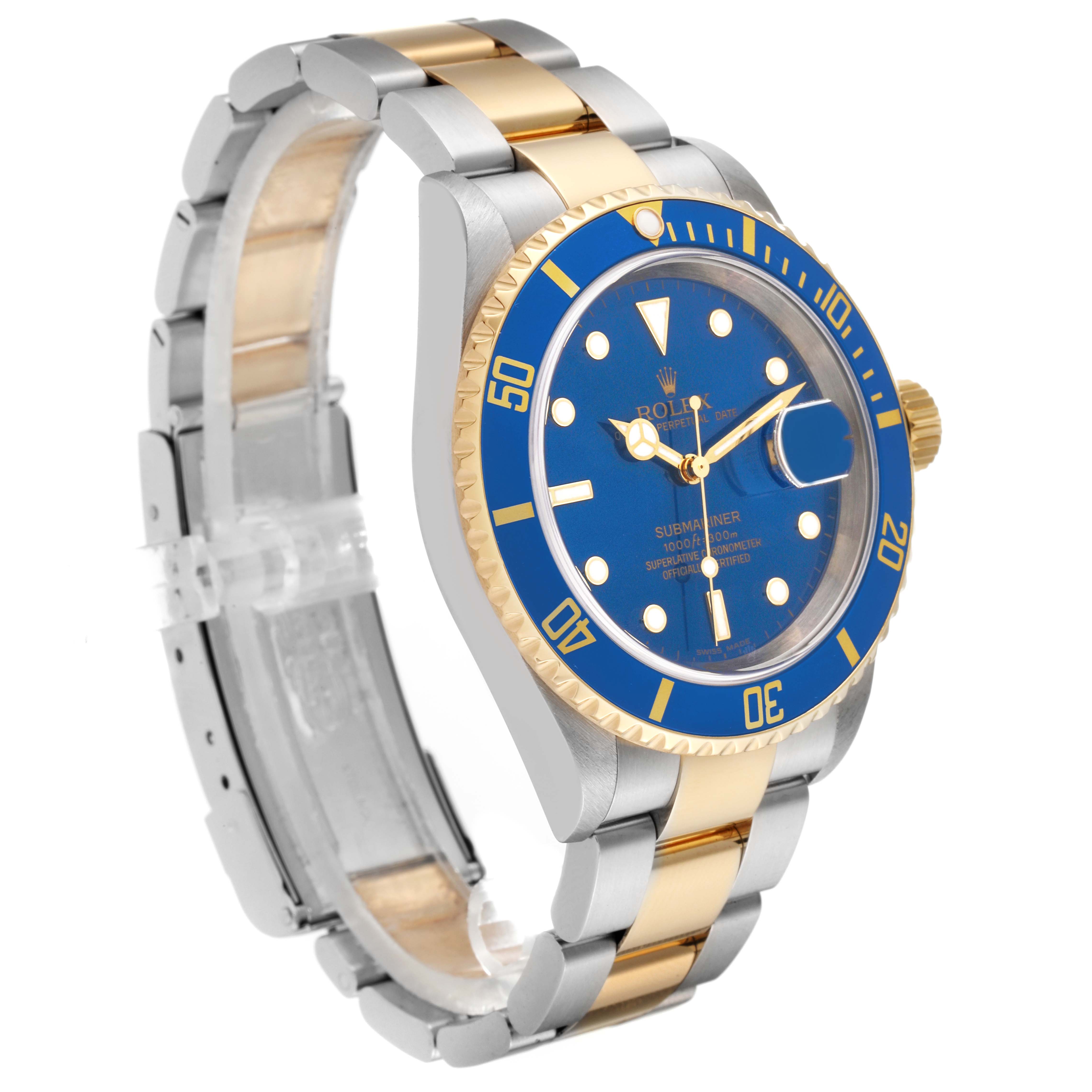 The image shows a Rolex Submariner 16613 Men's Steel and Gold (two tone) Blue Dial 16613 Men's Steel and Gold (two tone) Blue Dial model watch at an angle highlighting the face, bracelet, and crown.