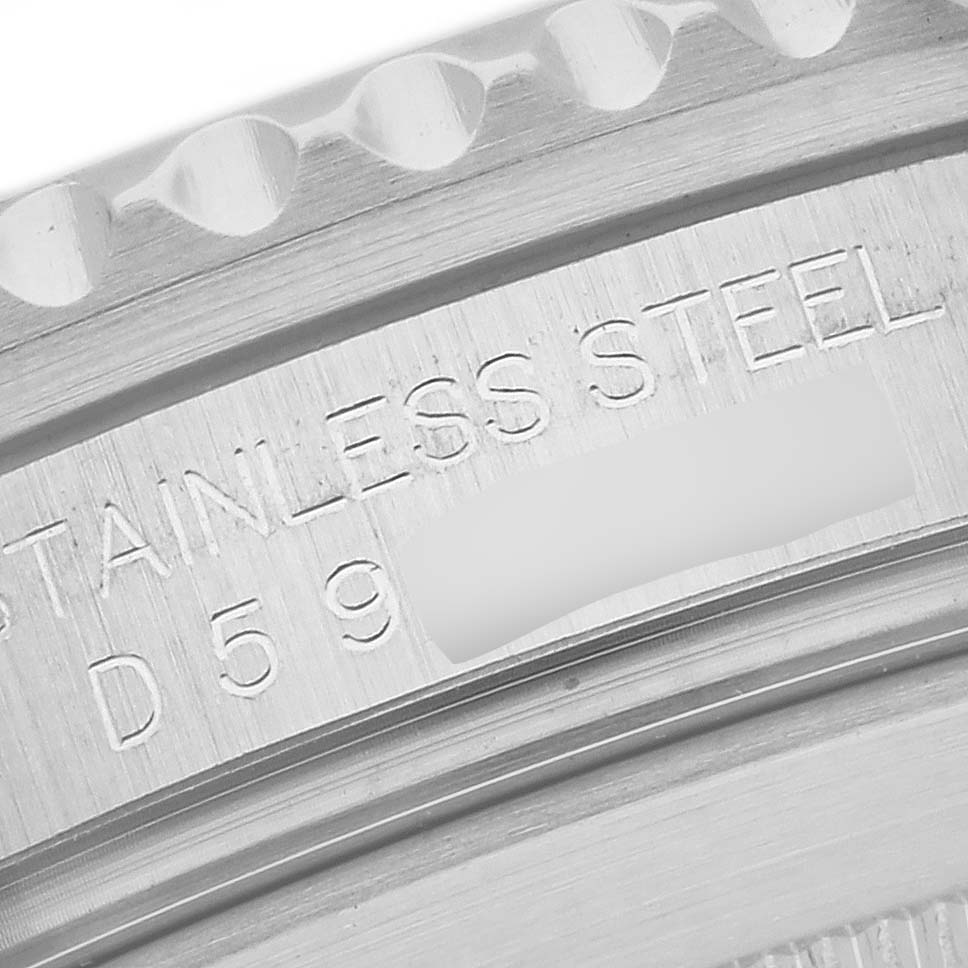 This close-up image shows the engraved serial number and "STAINLESS STEEL" text on the side of a Rolex Submariner 16610 Men's Stainless Steel Black Dial 16610 Men's Stainless Steel Black Dial watch case.