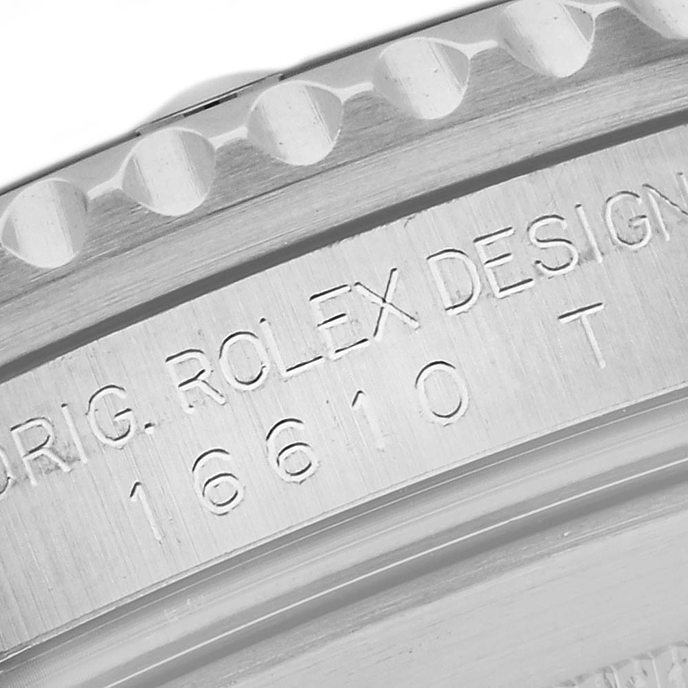 This image shows a close-up of the engraving on the side of the casing of a Rolex Submariner 16610 Men's Stainless Steel Black Dial 16610 Men's Stainless Steel Black Dial model 16610.