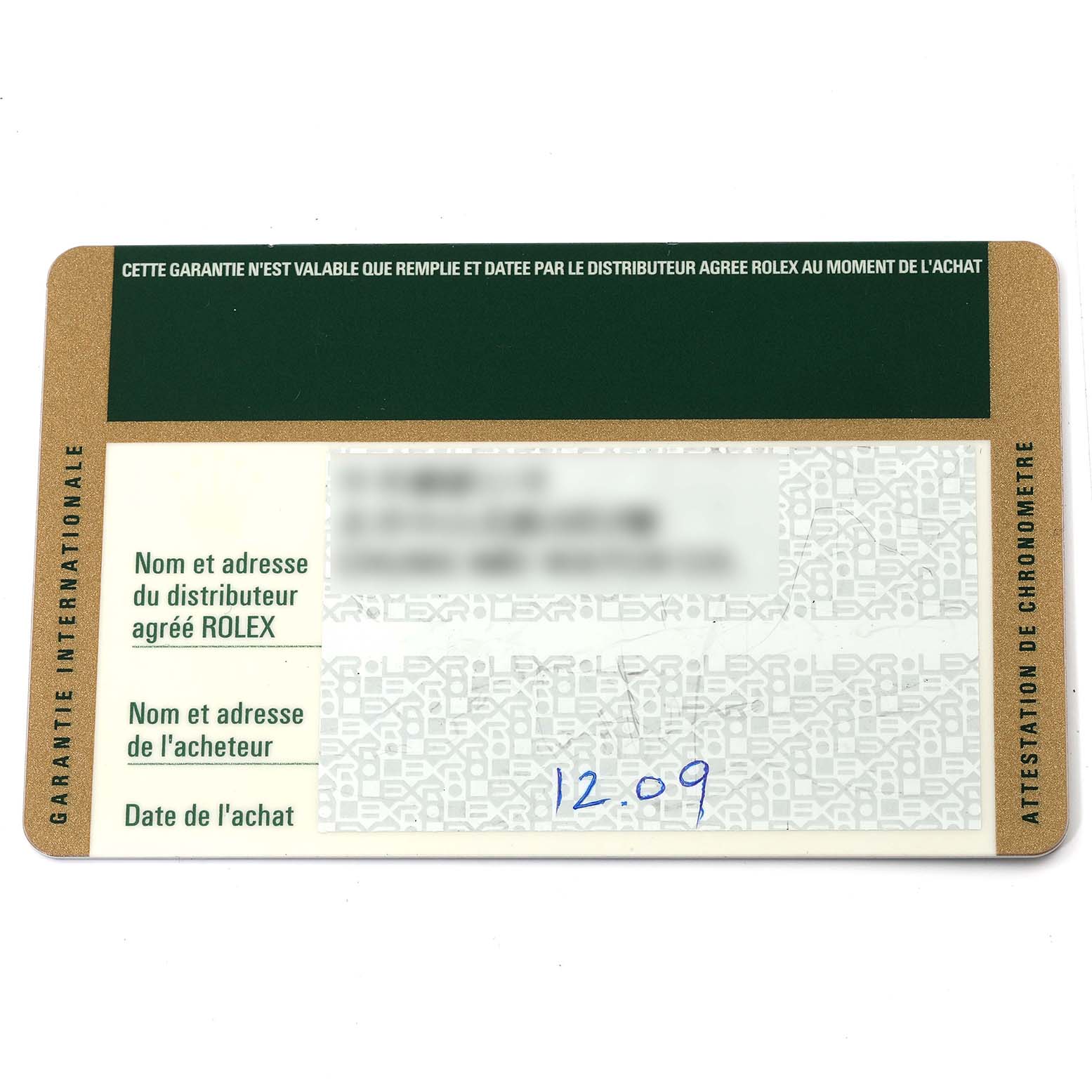 This is an angled shot of the warranty card for a Rolex Submariner 16610 T Men
s Stainless Steel Black Dial 16610 T Men
s Stainless Steel Black Dial watch.