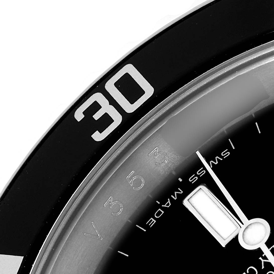 The image shows a close-up of the bezel and dial with the minute hand of a Rolex Submariner 16610 T Men
s Stainless Steel Black Dial 16610 T Men
s Stainless Steel Black Dial watch, focusing on the 30-minute mark.