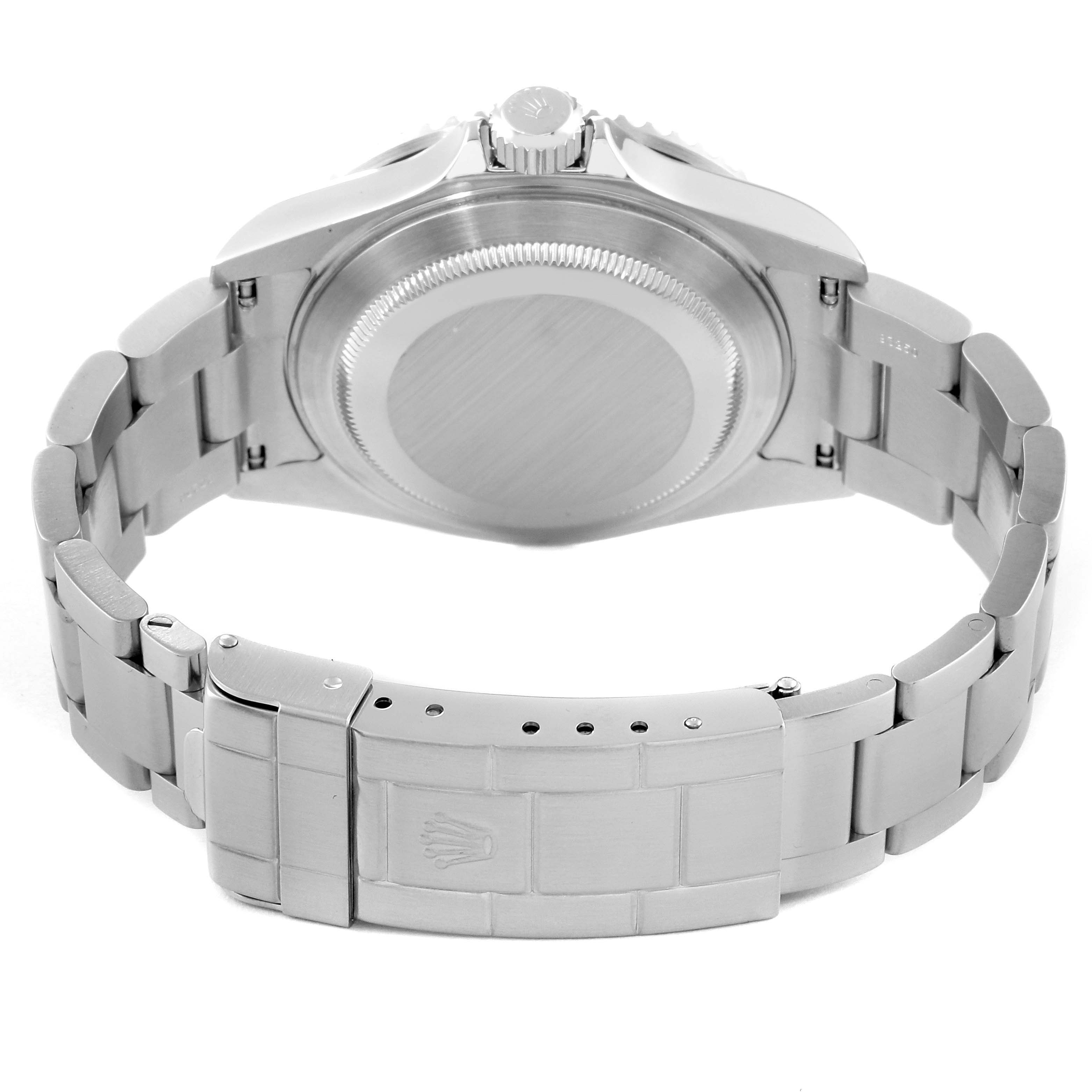 The image shows the back view of a Rolex Submariner 16610 Men's Stainless Steel Black Dial 16610 Men's Stainless Steel Black Dial watch, highlighting its case back, crown, and bracelet with clasp.