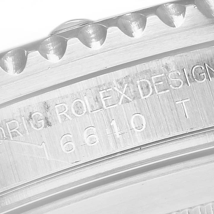 This image shows a close-up of the engraved side and bezel teeth of a Rolex Submariner 16610 Men's Stainless Steel Black Dial 16610 Men's Stainless Steel Black Dial watch, with model number 16610 visible.