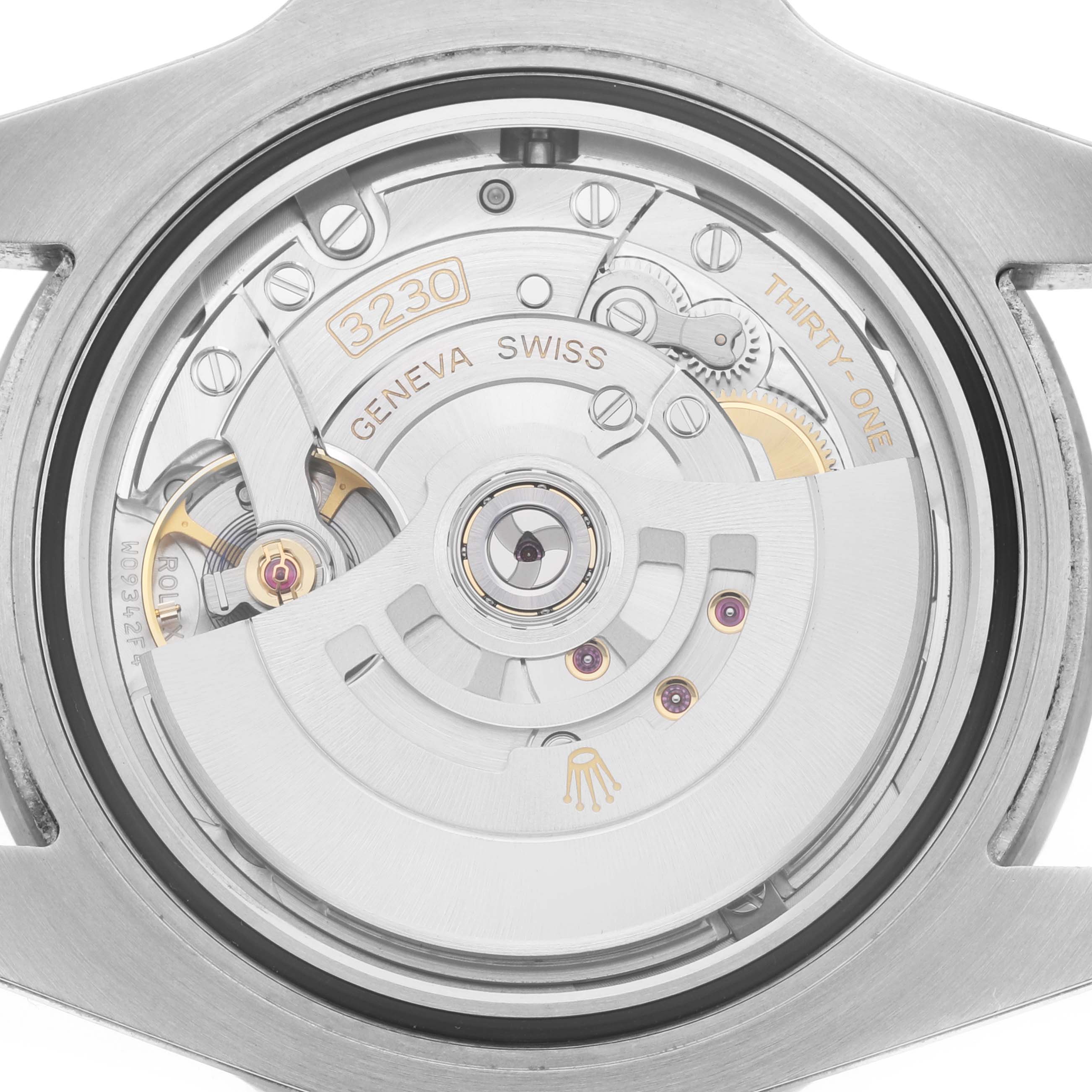 The image shows the open case back angle of a Rolex Submariner 124060 Men
s Stainless Steel Black Dial, revealing the movement and rotor.