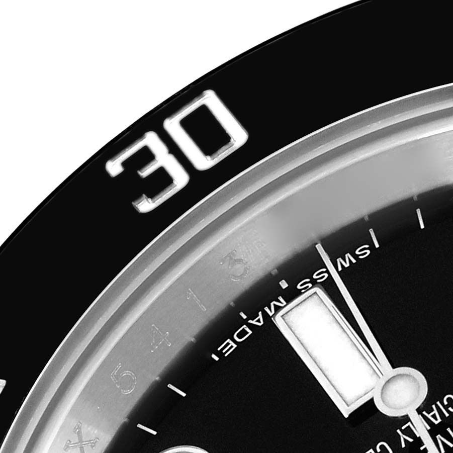 The image shows a close-up of the bezel, dial, and hands of a Rolex Submariner 114060 Men's Stainless Steel Black Dial watch, highlighting the "30" on the bezel.
