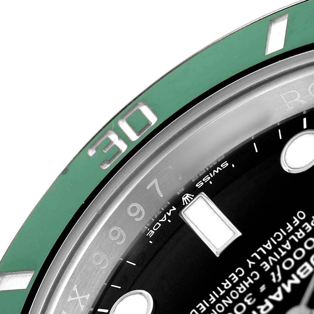 The image shows a close-up of the Rolex Submariner 126610LV Men's Stainless Steel Black Dial's green bezel and part of the watch face, angled to highlight the "30" marker.