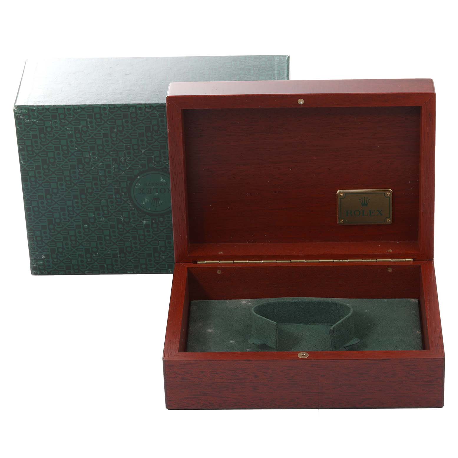 The image shows an open wooden Rolex box, possibly for a Submariner model, with a green cushion inside.