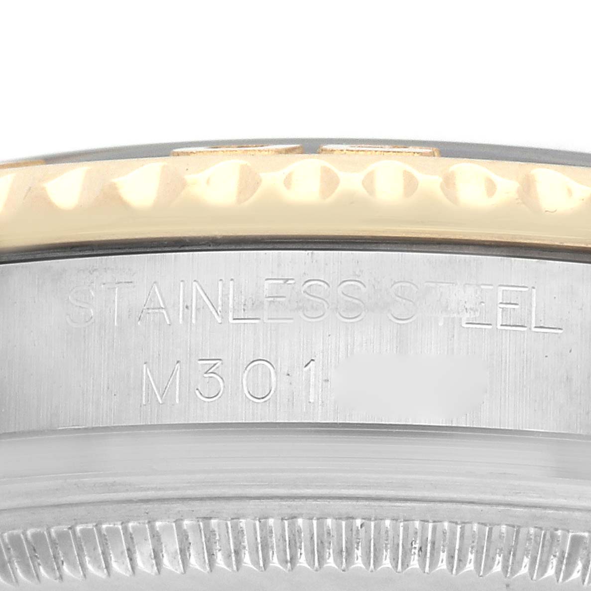 This close-up image shows the side view of the Rolex Yacht-Master 168623 Men
s Steel and Gold (two tone) Mother of Pearl Dial
s case with stainless steel engraving.