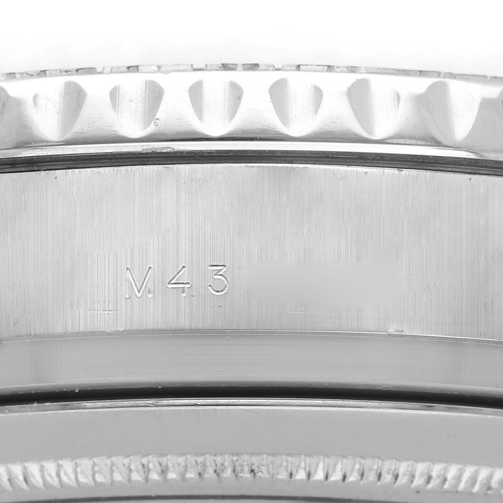 The image shows a close-up of the bezel edge and engraving on the side of the Rolex Yacht-Master 116689 Men's Platinum White Dial watch.