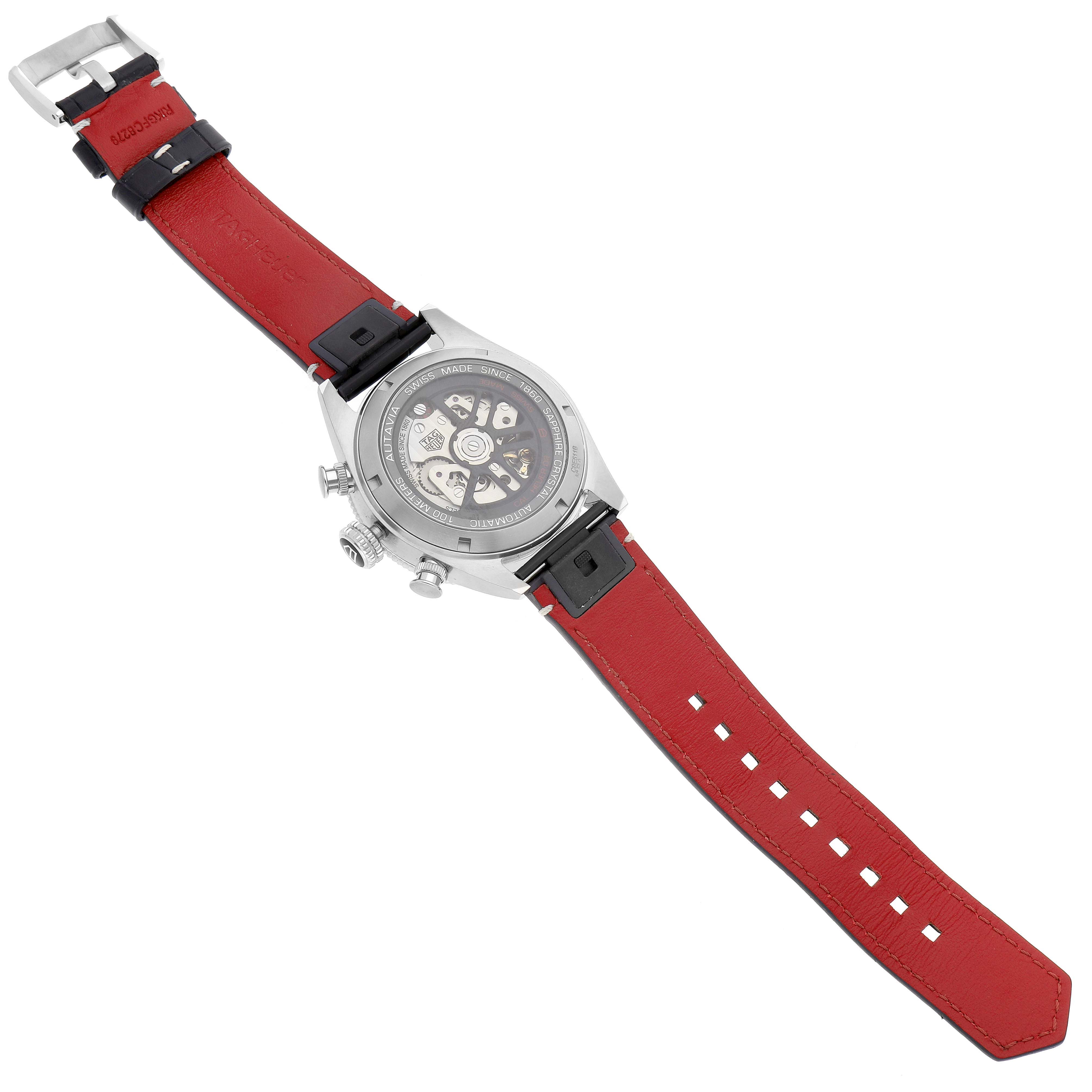 This image shows the back view of the Tag Heuer Autavia CBE511B.FC8279 Men's Stainless Steel Black Dial CBE511B.FC8279 Men's Stainless Steel Black Dial watch with its case back and red strap visible.